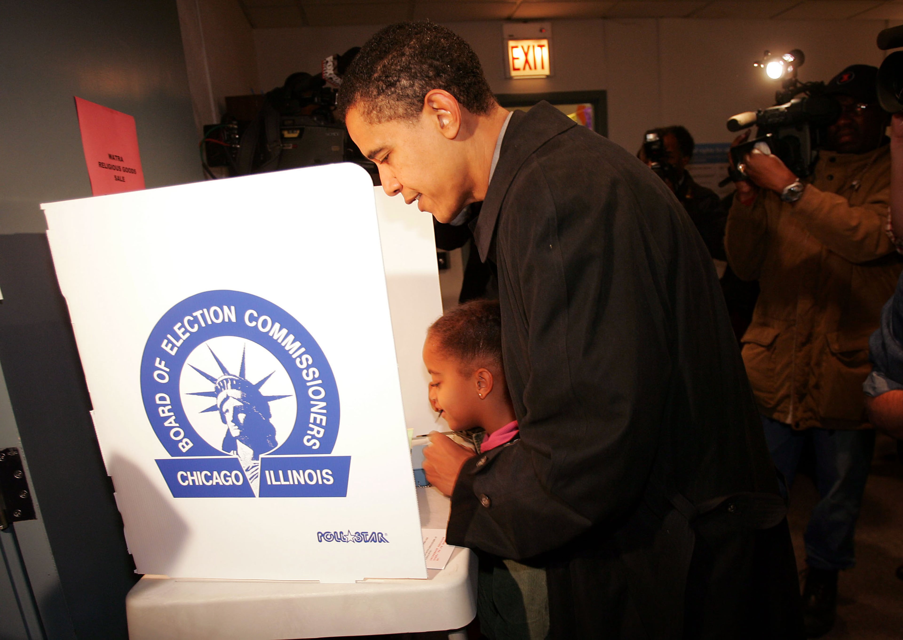 Candidate for the U.S. Senate Barack Obama casts his vote with the help of his daughter Malia November 2, 2004 in Chicago, Illinois. Obama is expected to win easily against Republican candidate Alan Keyes. (Photo by Scott Olson/Getty Images)