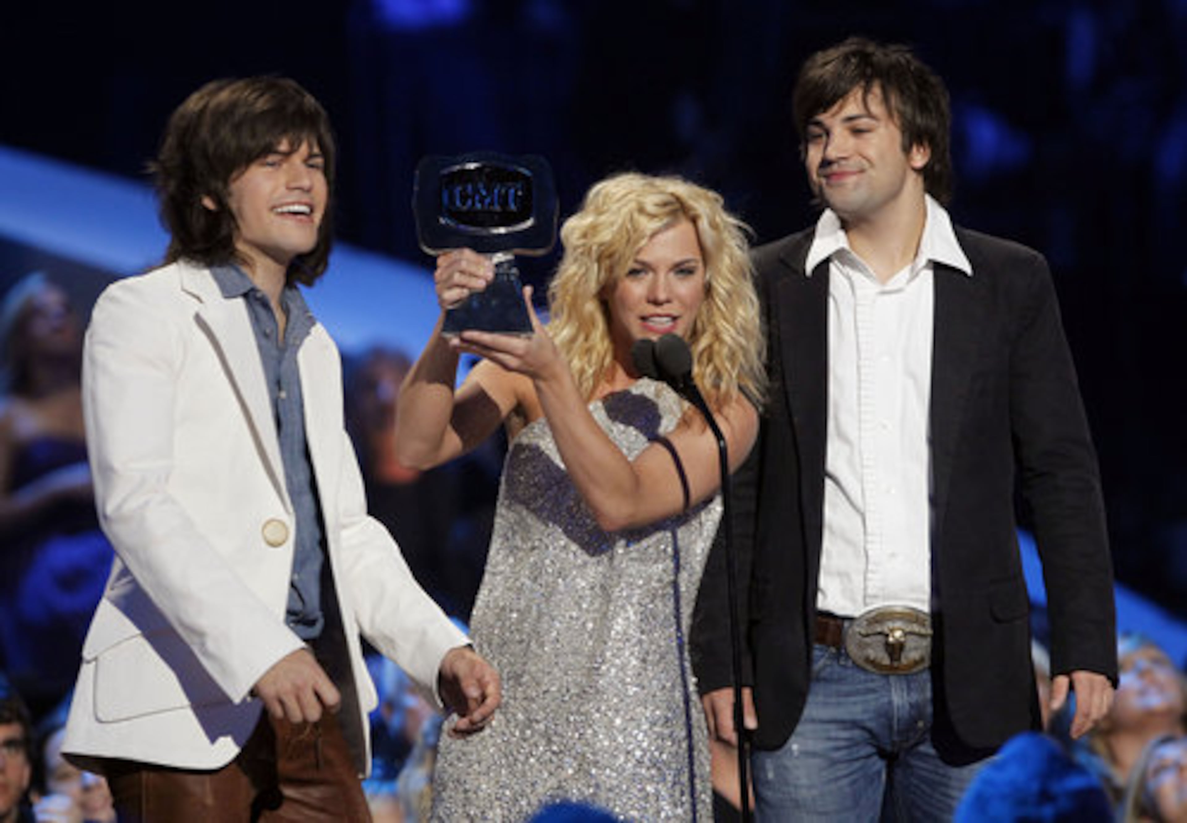 Reid, Kimberly and Neil Perry from The Band Perry accept the Breakthrough Video of the Year Award.