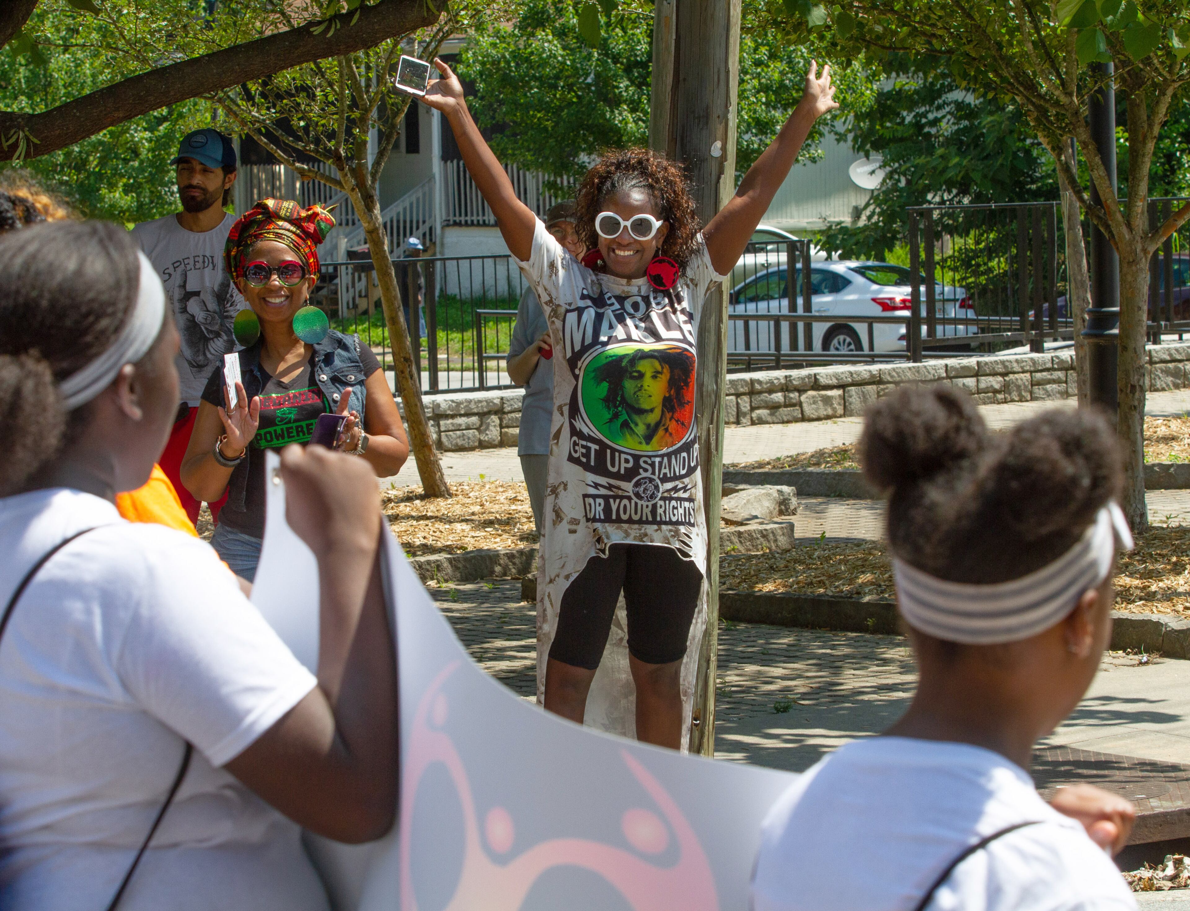 Tina Stewart (C) cheers on the participants during the Juneteenth Atlanta Black History Parade on Saturday, June 15, 2019.
STEVE SCHAEFER / SPECIAL TO THE AJC