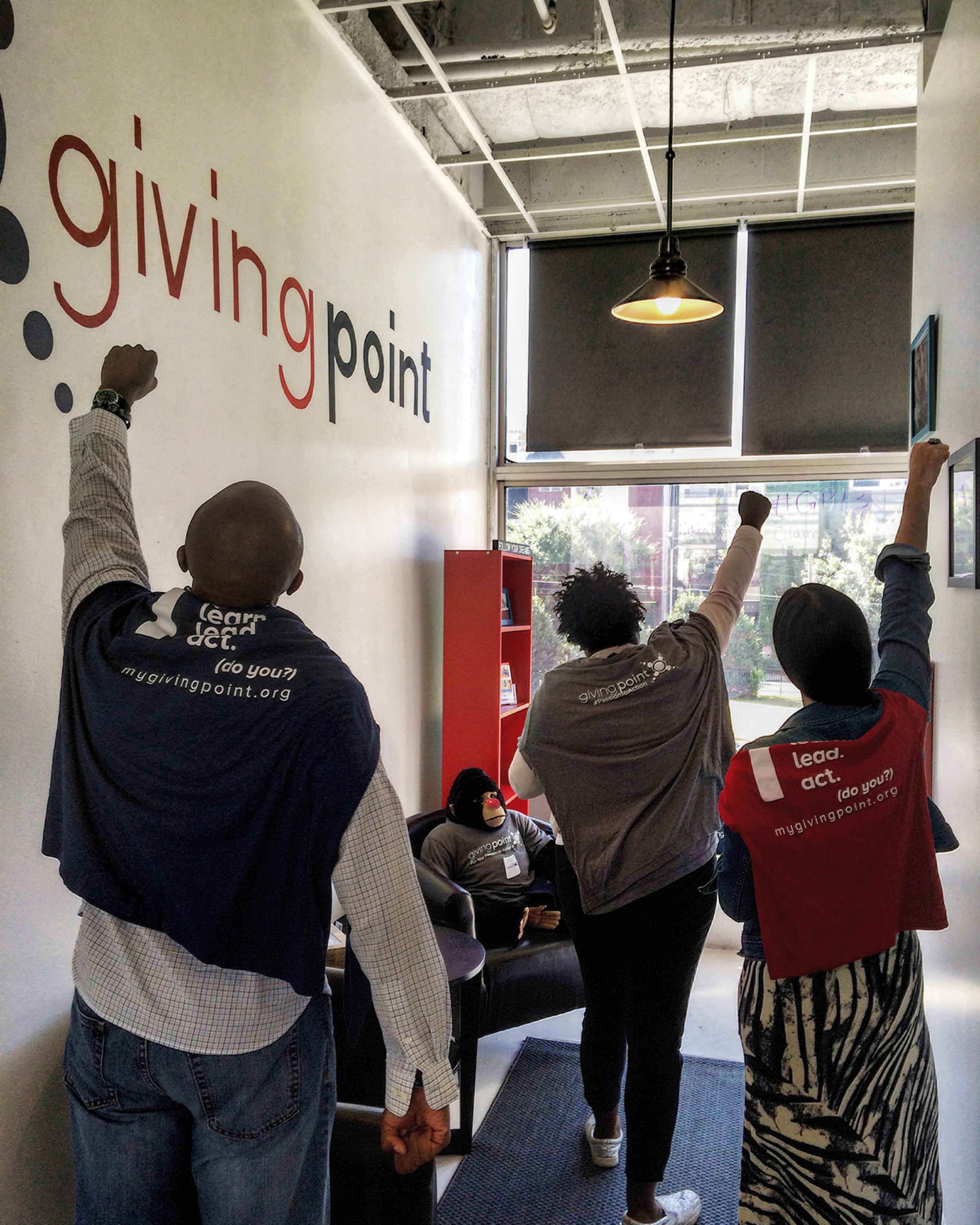 GivingPoint, a youth development nonprofit here in Atlanta, suited up in honor of 5 year old #HudsonLillystone and #CapeDayATL. #PassionToAction. Photo courtesy of Kellye Call