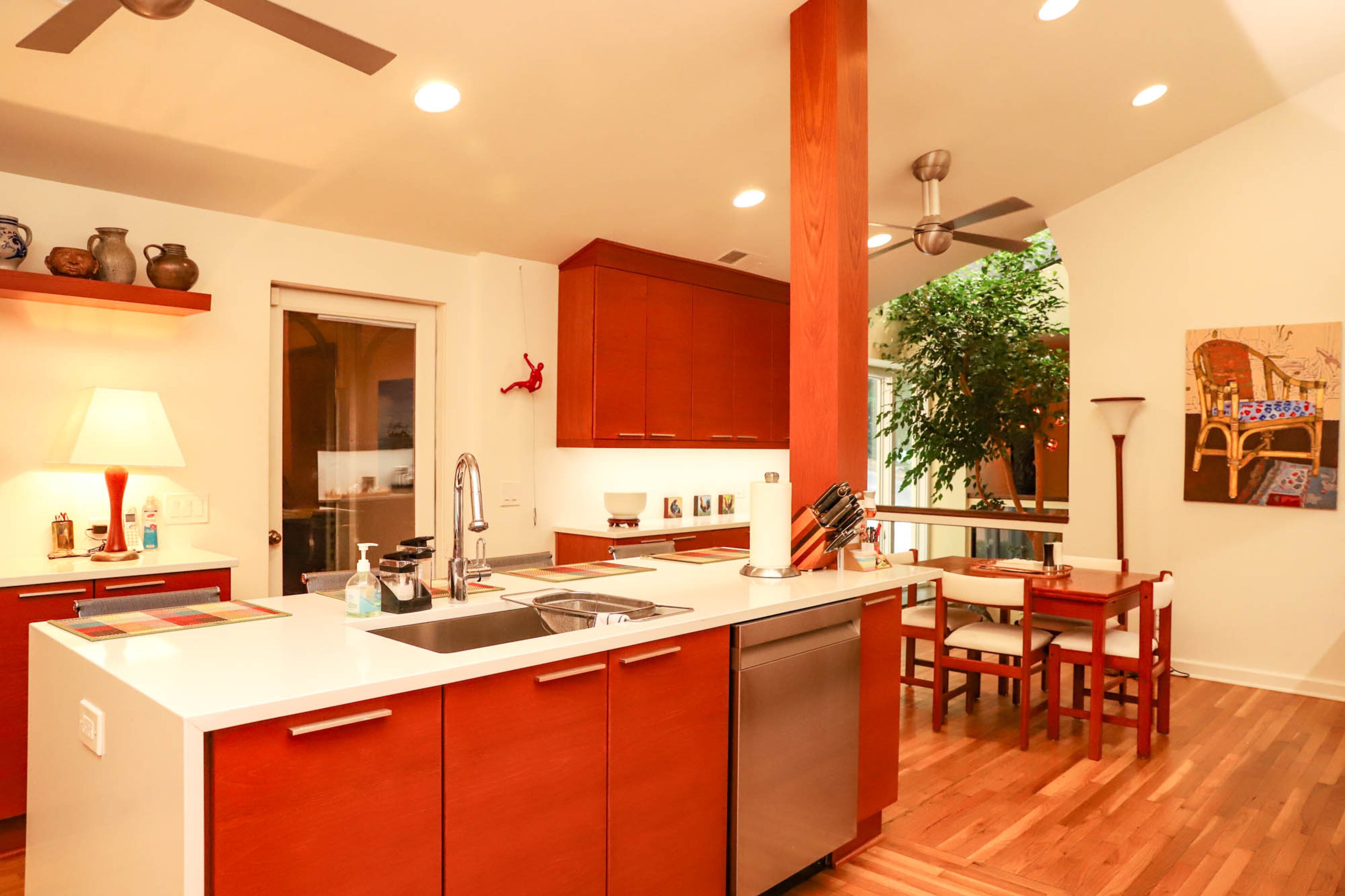 Last year David Copeland and Hans Frabel renovated their kitchen, working with John Curry to install all new teak cabinets. In the kitchen they have a wall climber figure that they bought on a trip to Germany after seeing life-sized ones on a building in Düsseldorf, Germany. Text by Shannon Dominy/Photo by Reynolds Rogers