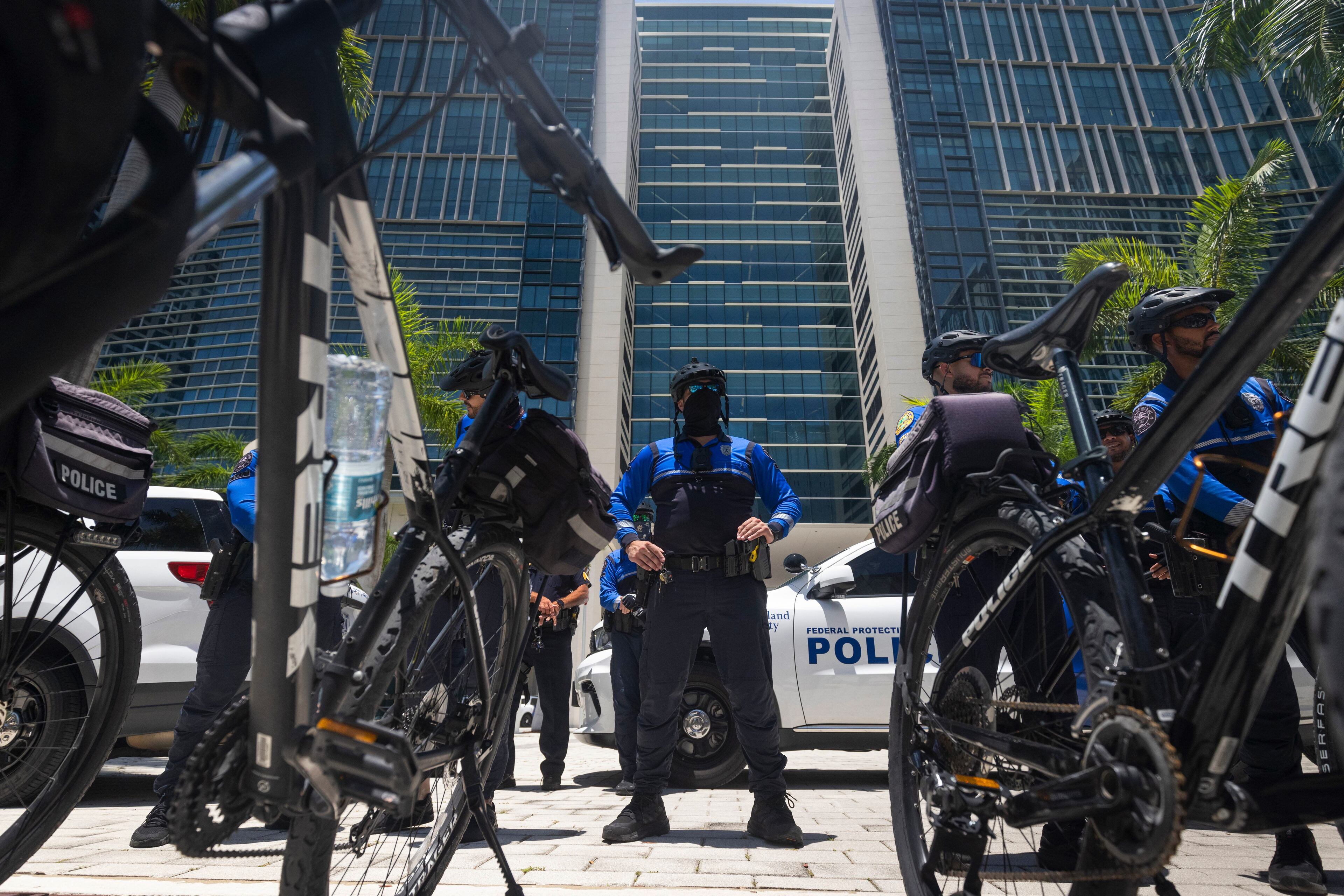 Miami Police stand watch outside the Wilkie D. Ferguson Jr. U.S. Courthouse in Miami, June 13, 2023. Donald J. Trump is set to become the first former president to be arraigned on federal charges when he appears in a Miami courtroom on Tuesday to face charges that he illegally retained national security documents after leaving office, obstructed efforts to retrieve them and made false statements about the matter. (Christian Monterrosa/The New York Times)