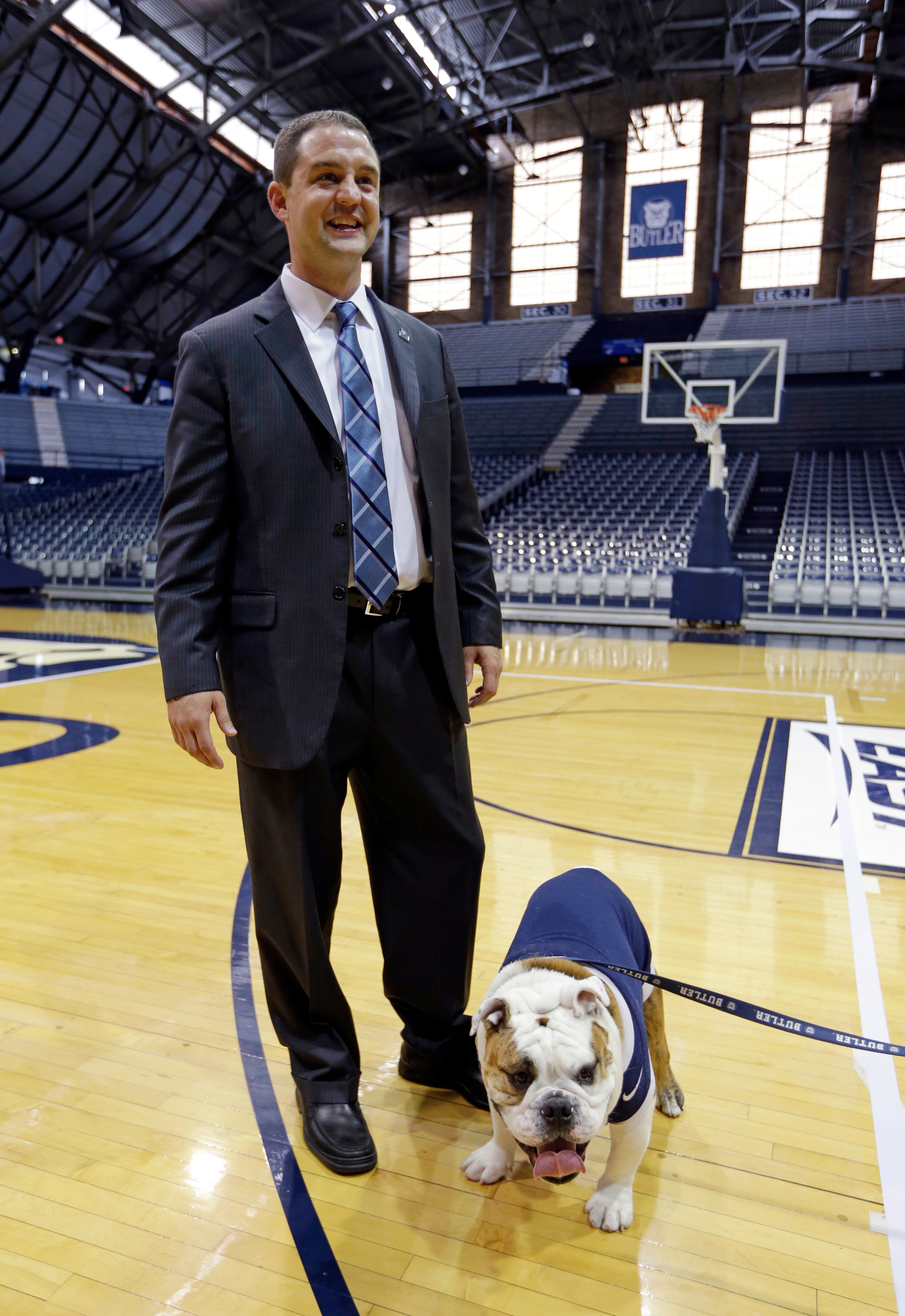 Brandon Miller meets with Butler Blue III, after Miller was announced as the new men's basketball coach at Butler, in Indianapolis, Saturday, July 6, 2013. Miller, a former Butler point guard and assistant coach, replaces Brad Stevens, who left Butler to become head coach of the Boston Celtics. (AP Photo/Michael Conroy)