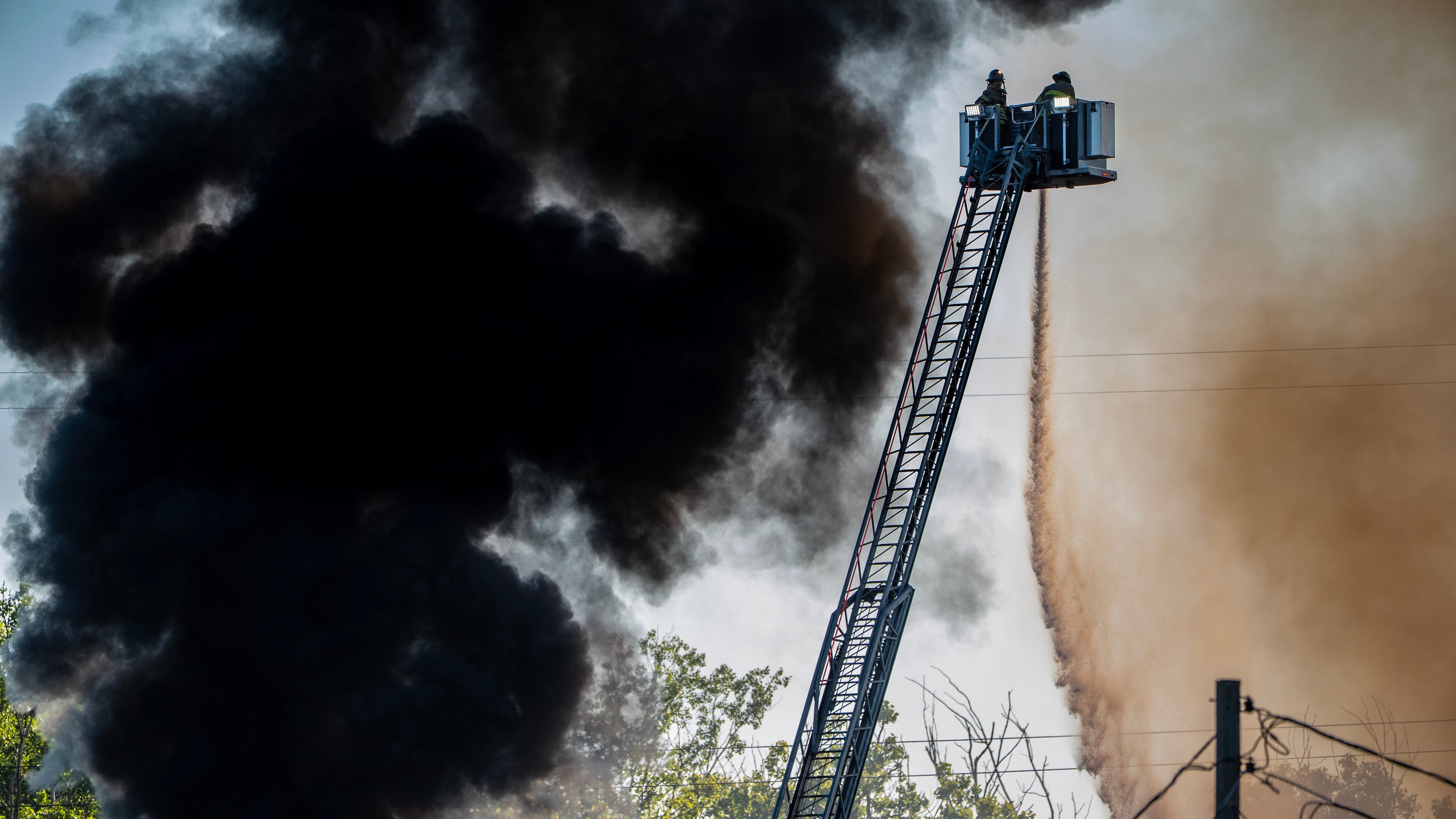 Firefighters work to put out a blaze after an explosion at Brent Industries, Tuesday, Aug. 18, 2026, in Toledo, Ohio. (Jeremy Wadsworth/The Blade via AP)