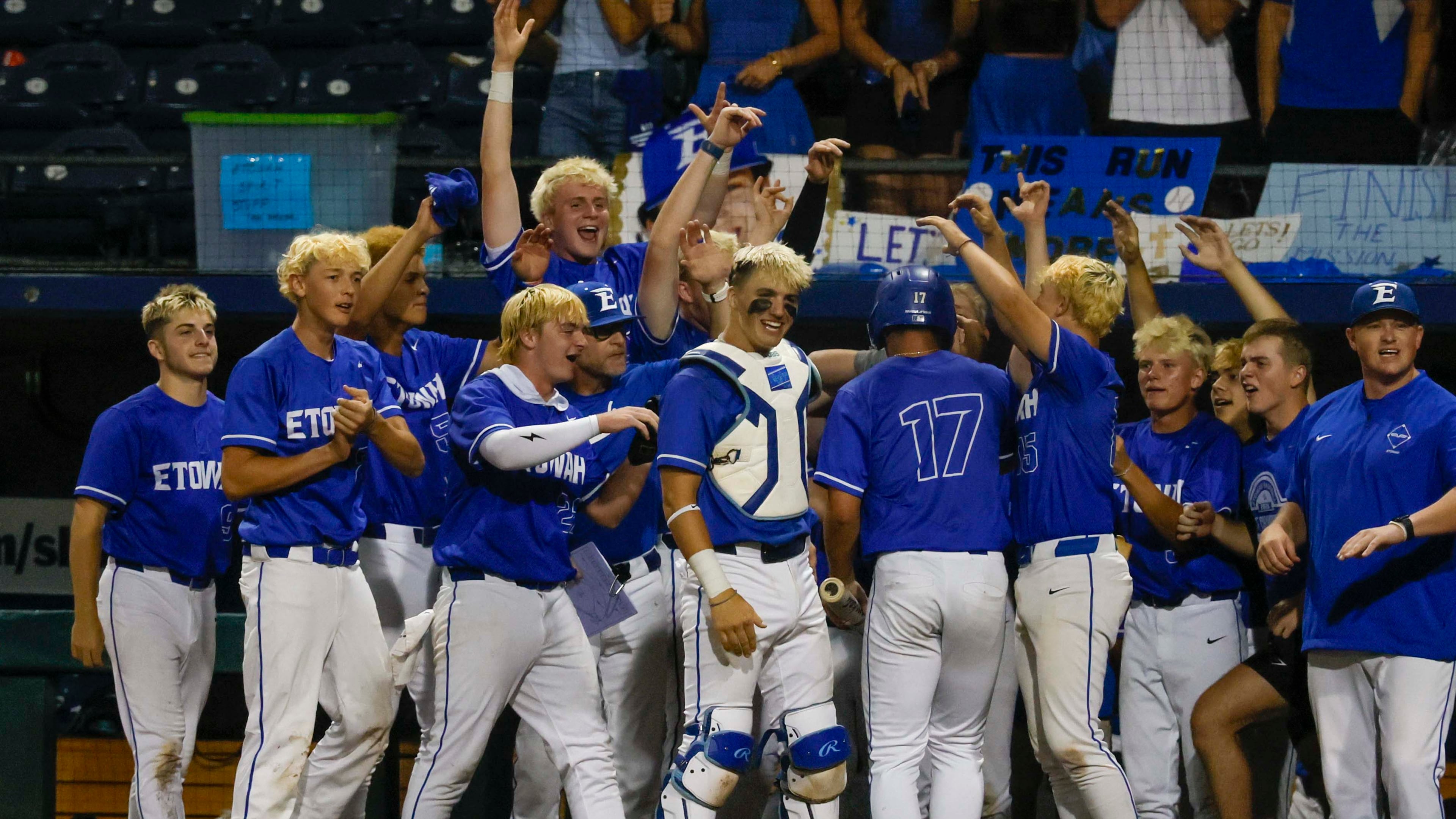 Etowah Eagles players celebrate with first baseman Carson Moore after he scores against North Paulding during the second inning of Game 1 of the Class 6A GHSA baseball finals at Gwinnett Field on Tuesday, May 26, 2026, in Lawrenceville, Ga. (Miguel Martinez/AJC)