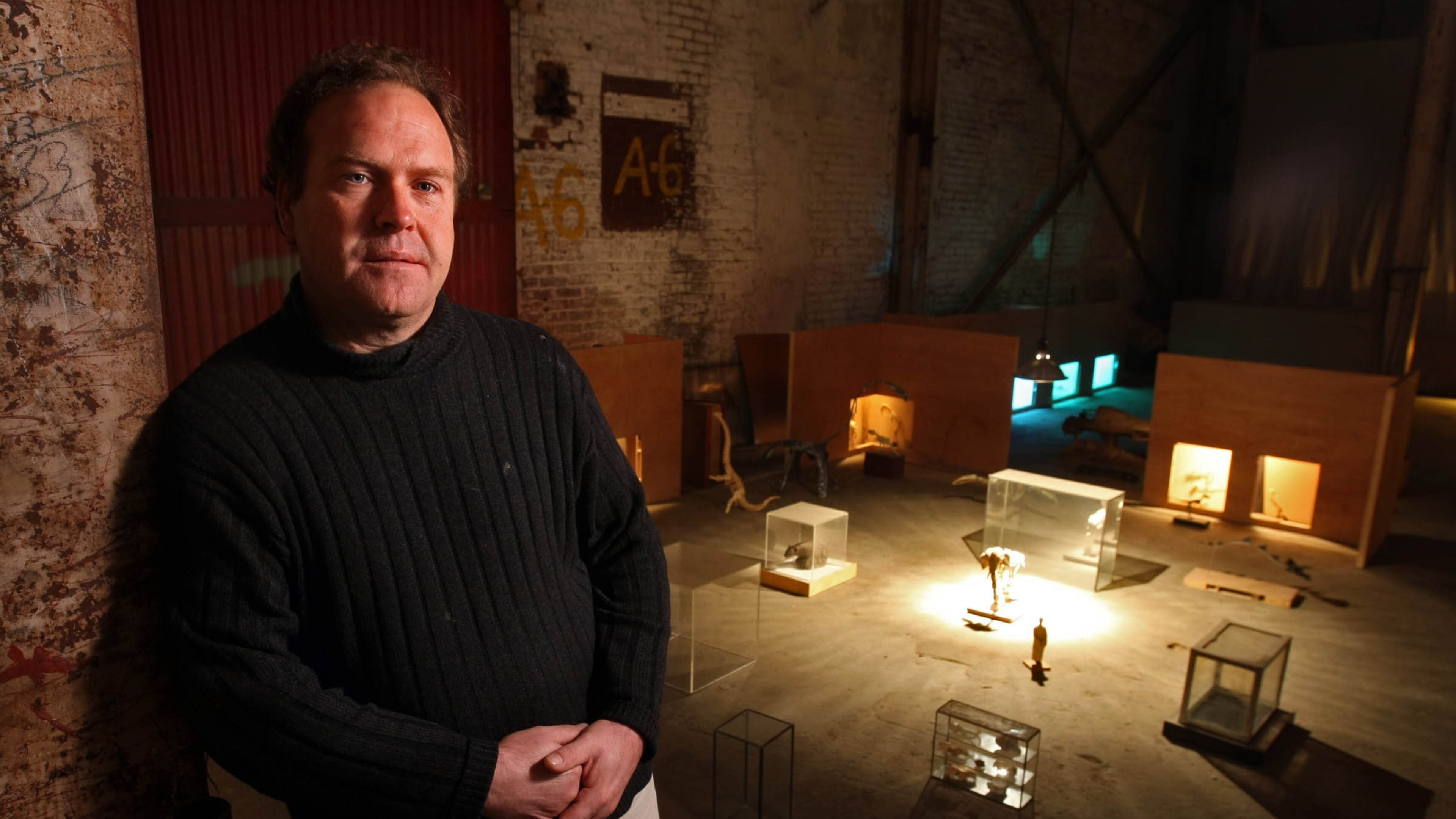 In this photo from 2009 Todd Murphy is shown with a miniature installation in his studio. Murphy was collected by such prominent Atlantans as Elton John and Peter Conlon, his work appeared both in the High Museum of Art and on album covers. Jason Getz, jgetz@ajc.com