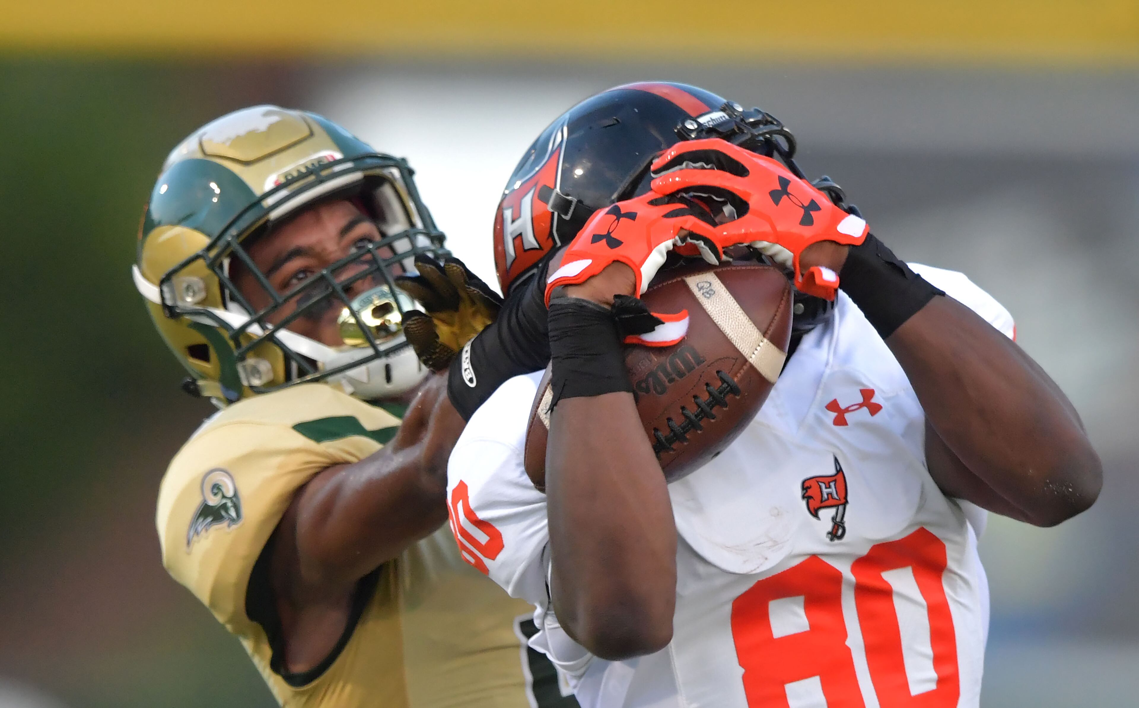 Hoover's Shedrick Jackson (80) makes a catch against Grayson's Kenyatta Watson (2) in the first half of Grayson vs Hoover (Alabama) at Grayson High School in Loganville on Friday, August 25, 2017. HYOSUB SHIN / HSHIN@AJC.COM