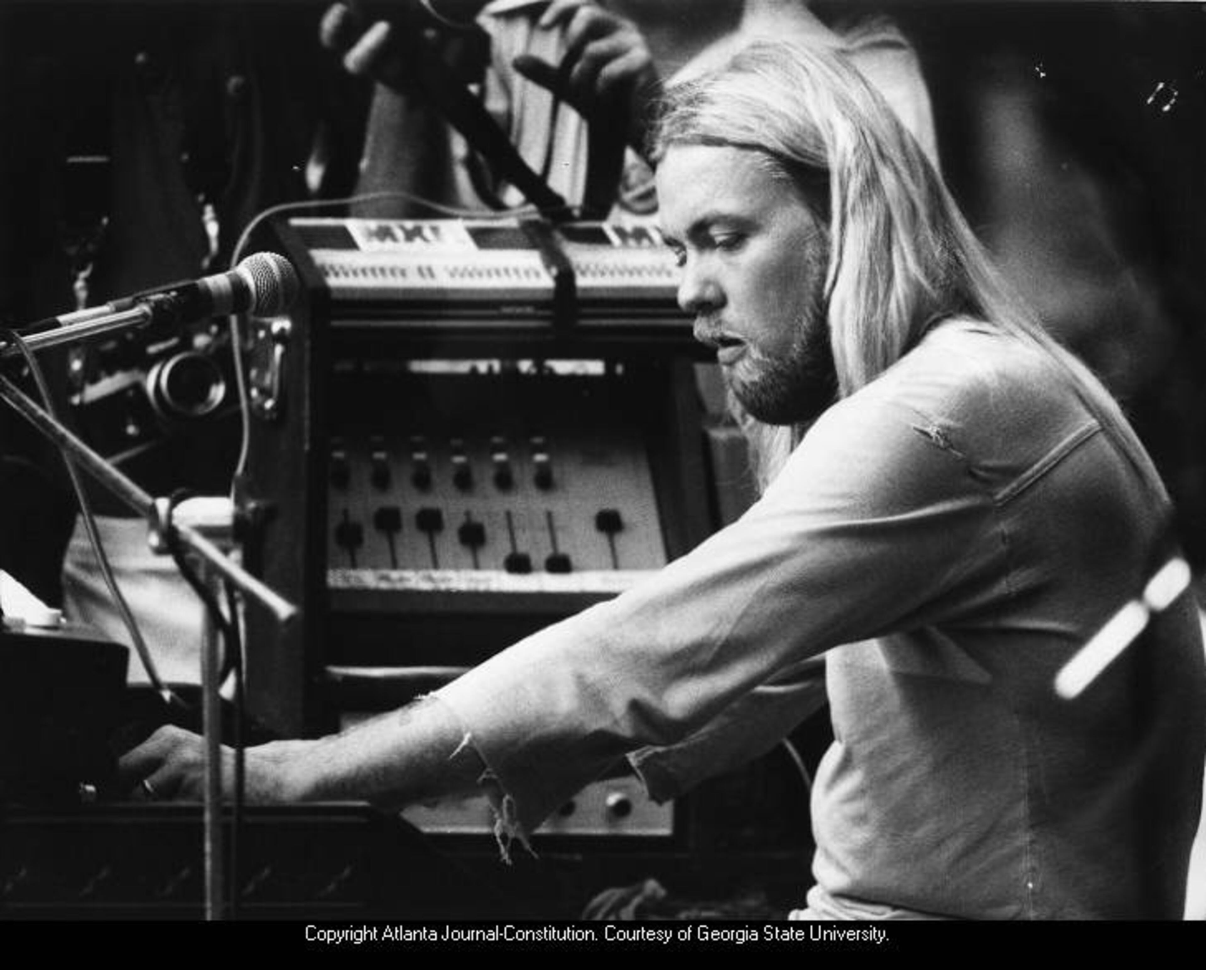 1978 -- Gregg Allman performs with the Allman Brothers Band at the annual Capricorn Picnic in Macon. JEROME McCLENDON / AJC FILE