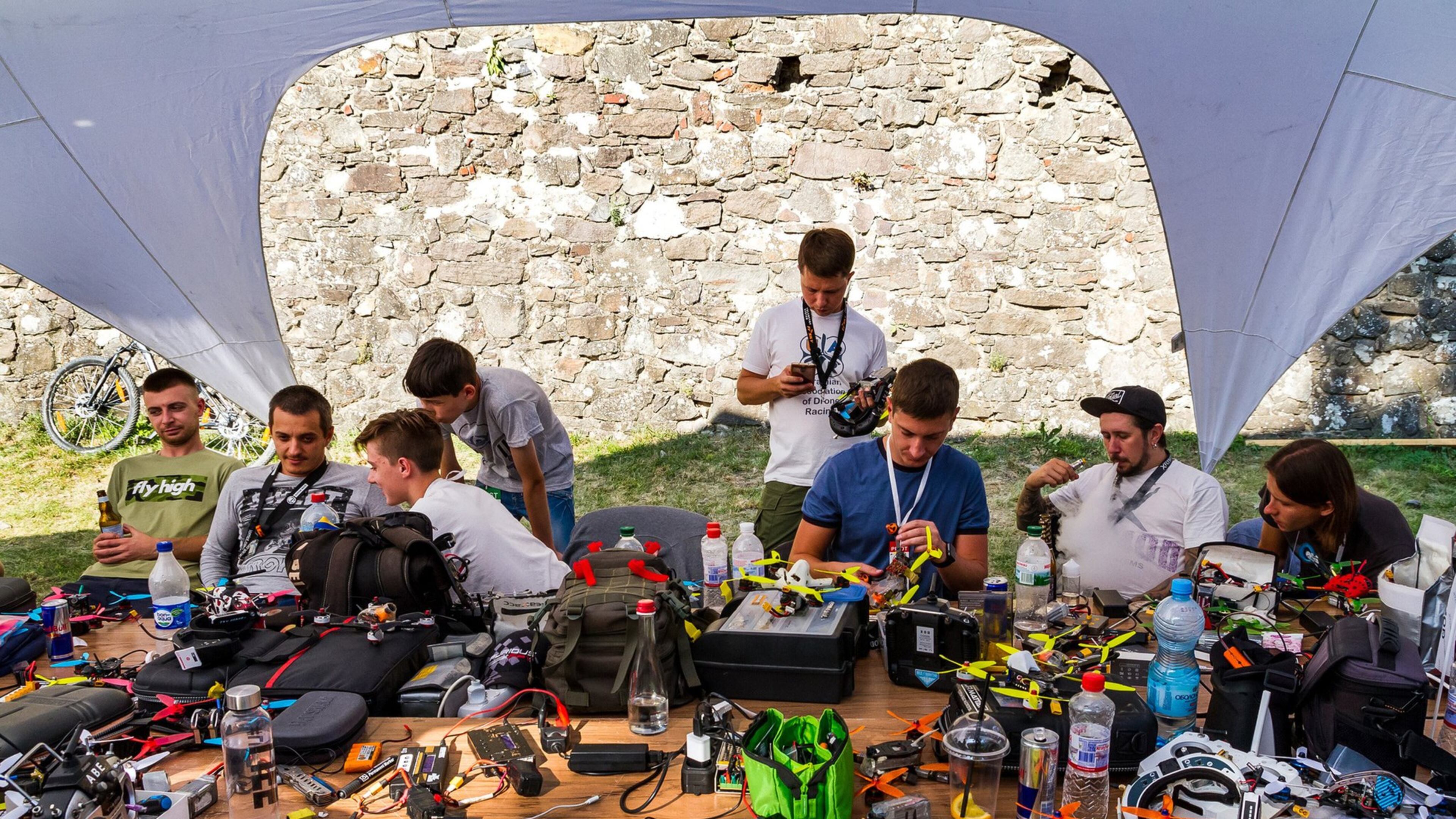 Competitors repair their drones in the repair area during the Eastern European Cup 2017 on September 2, 2017 in Uzhgorod, Ukraine. A Naperville, Ill. startup hub is looking to include an indoor drone racing track for quadcopter pilots to race. (Yanosh Nemesh/Dreamstime/TNS)