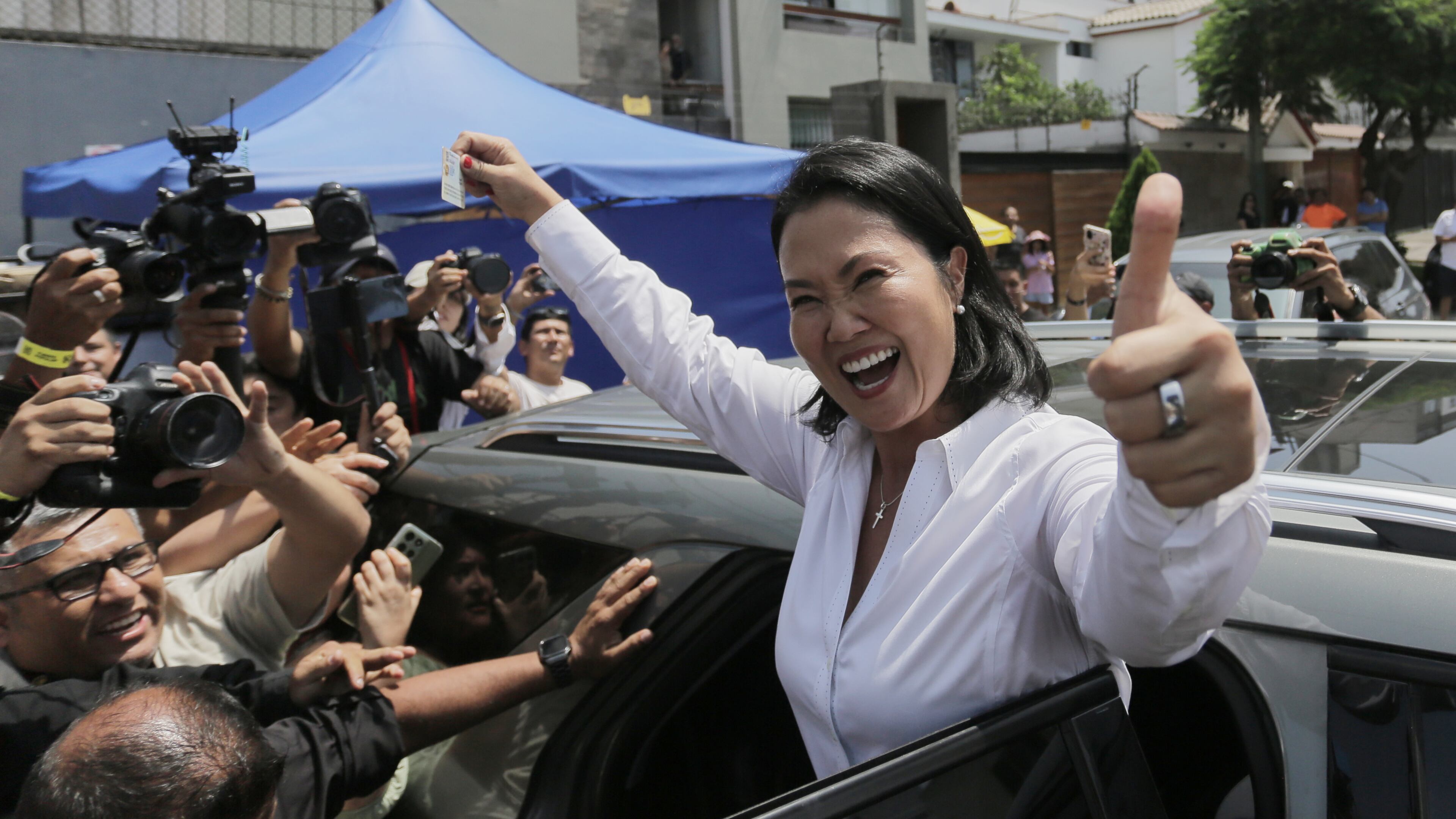Keiko Fujimori, presidential candidate of the Popular Force party, departs a polling station after voting during general elections in Lima, Peru, Sunday, April 12, 2026. (AP Photo/Gerardo Marin)