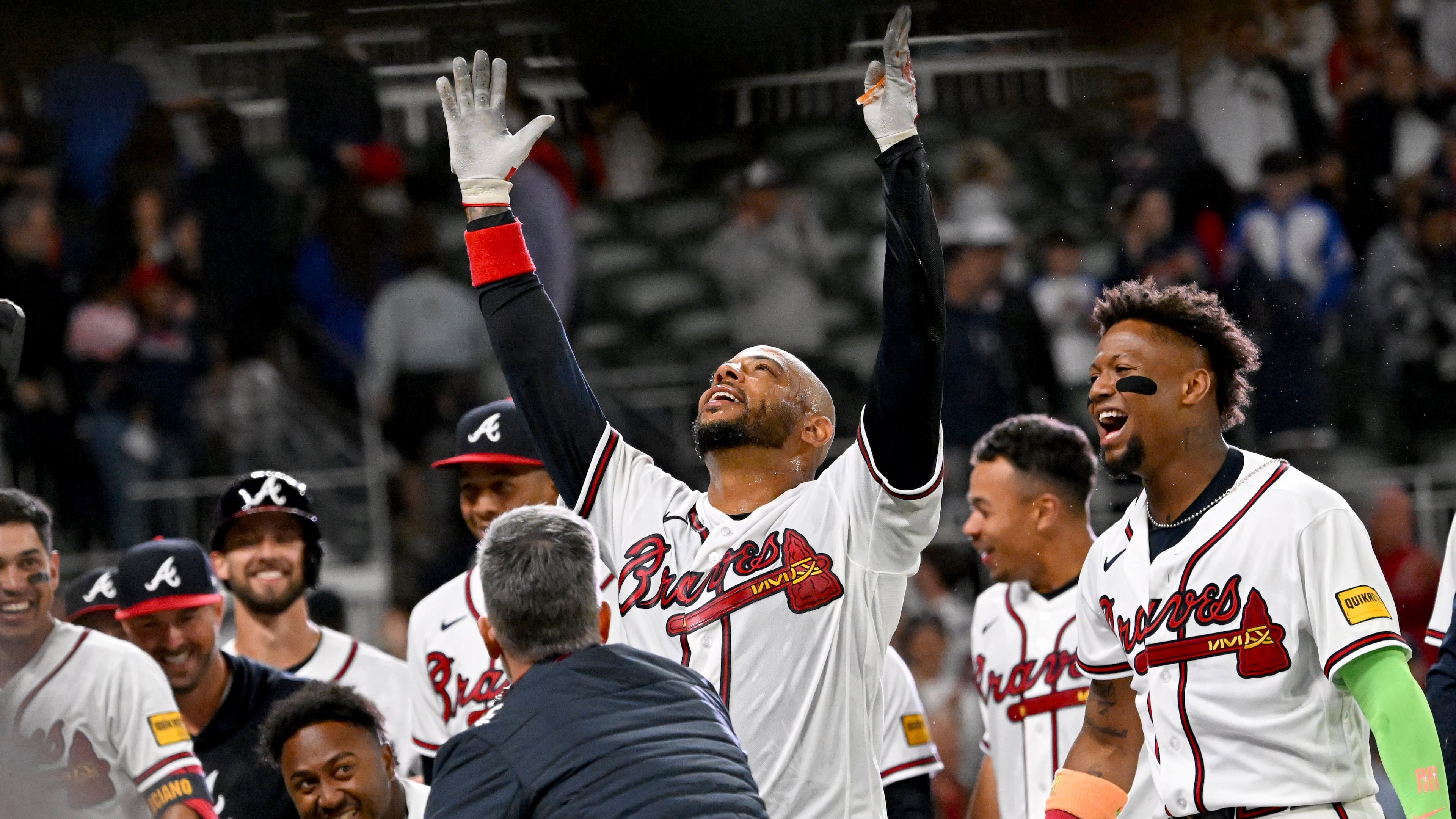 Atlanta Braves Dominic Smith celebrates with teammates after hitting a grand slam to win 6-2 over Kansas City Royals during the 9th inning of a baseball game at Truist Park, Saturday, March 28, 2026, in Atlanta. (Hyosub Shin/AJC)