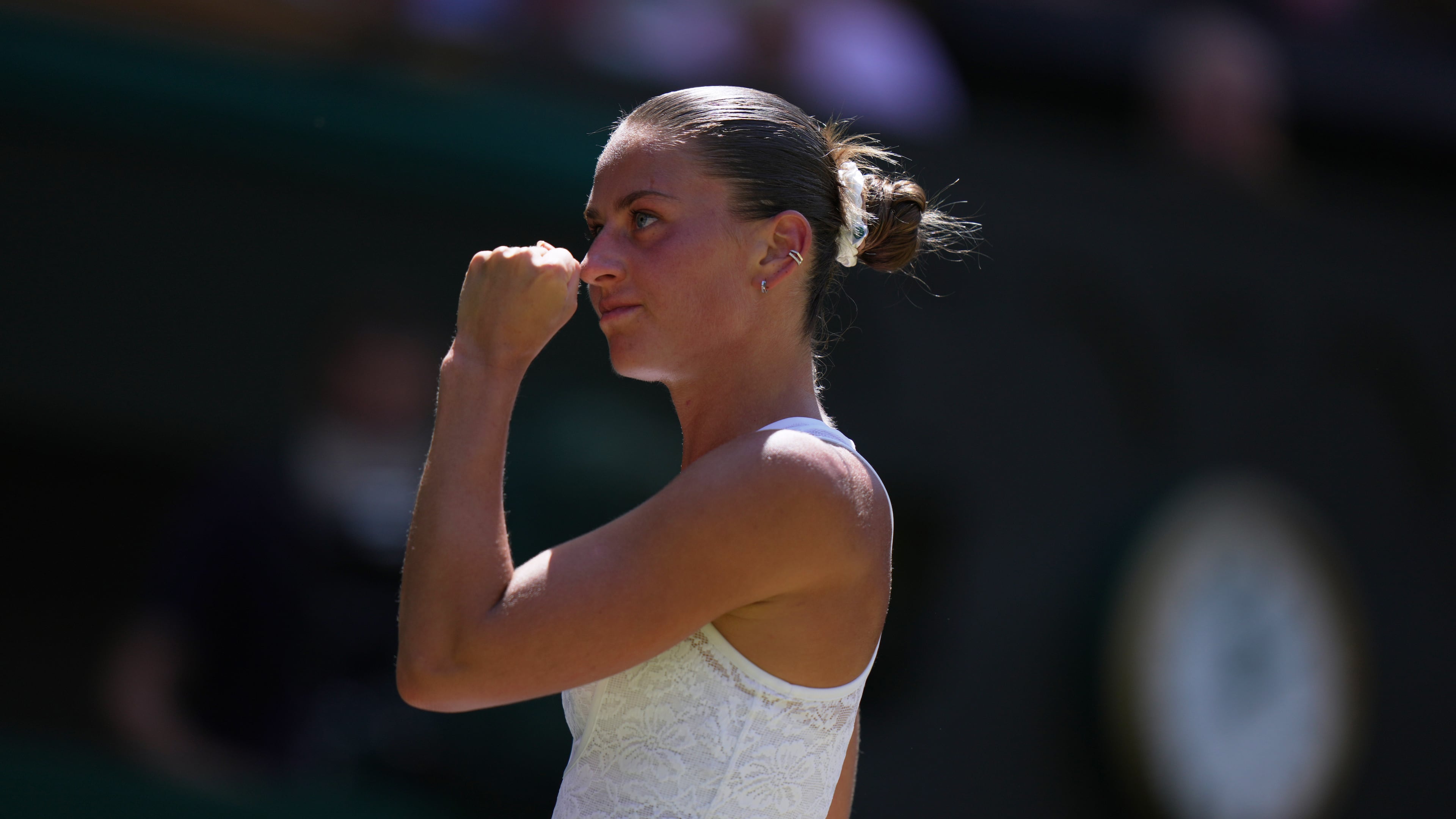 Marta Kostyuk of Ukraine celebrates a point against Jasmine Paolini of Italy, in their quarter-final women's singles match at the Wimbledon Tennis Championships in London, Wednesday, July 8, 2026. (AP Photo/Brian Inganga)
