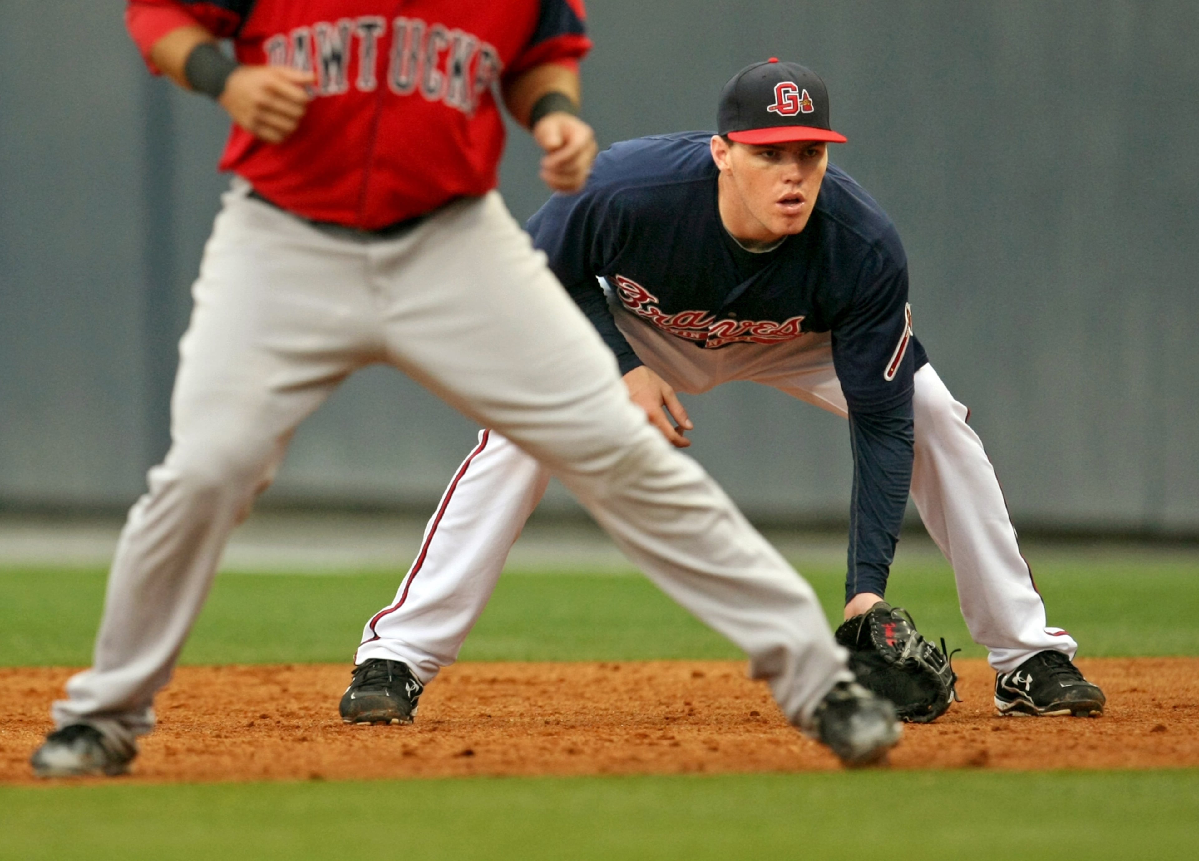 100503 Lawrenceville, Ga., -- Gwinnett Braves first baseman Freddie Freeman watches a batter as Pawtucket Red Sox base runner Dusty Brown, left, jumps off of first base during a pitch of their game Monday evening at Coolray Field in Lawrenceville, Ga., May 3, 2010. The world is well aware of Jason Heyward, but what about Freddie Freeman, his best friend and one of the Braves top prospects. Freeman had moved in perfect synch with Heyward through the team's minor league structure until this season. Freeman plays at Triple-A Gwinnett. Jason Getz, jgetz@ajc.com