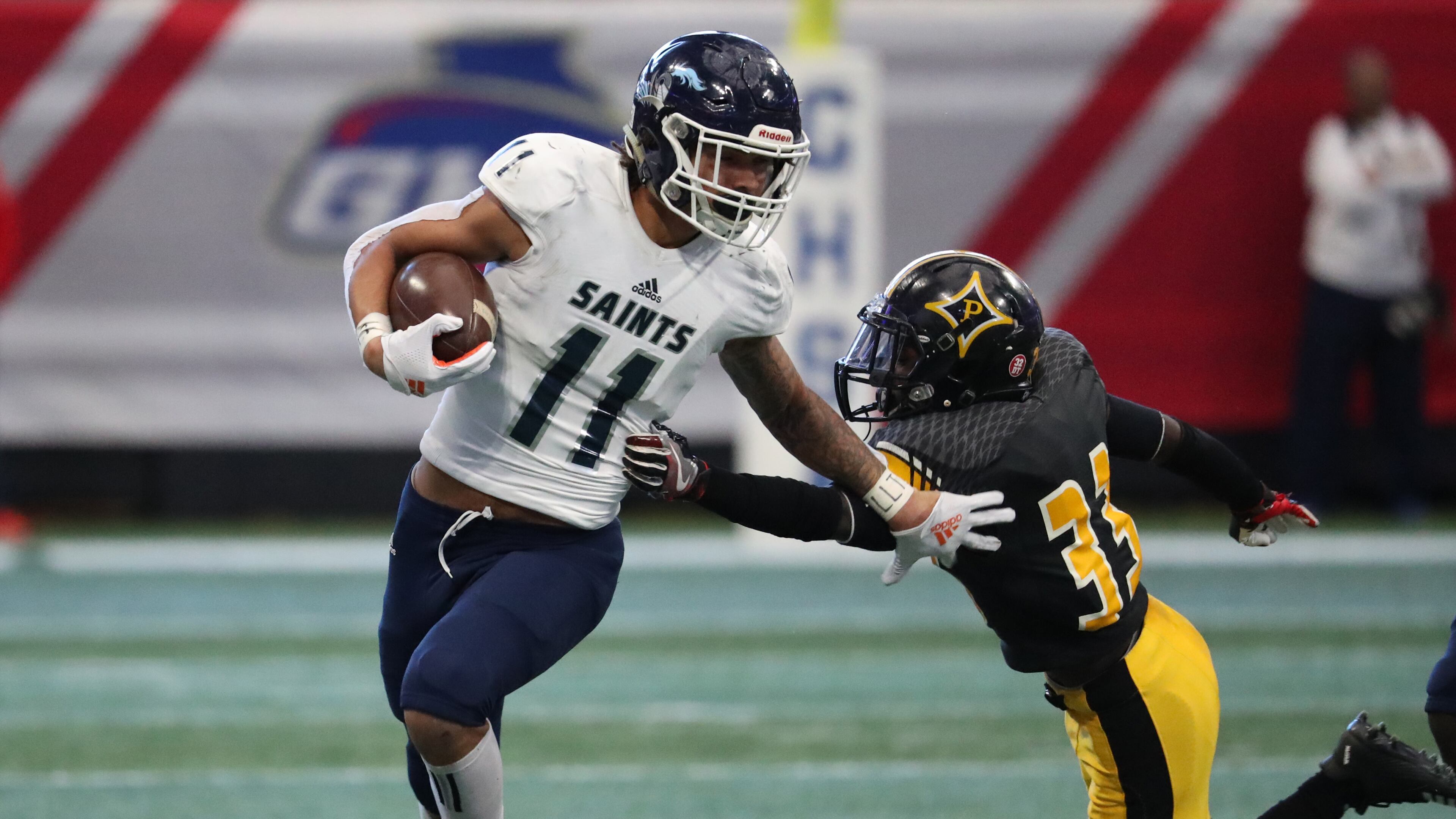 Cedar Grove wide receiver Jadon Haselwood (11) makes a move on Peach County defensive back Otiserion French on a kickoff return in the first half of the Class AAA State Championship at Mercedes-Benz Stadium, Tuesday, December 11, 2018, in Atlanta. The play was called back on a penalty by Cedar Grove. (Jason Getz/Special to the AJC)