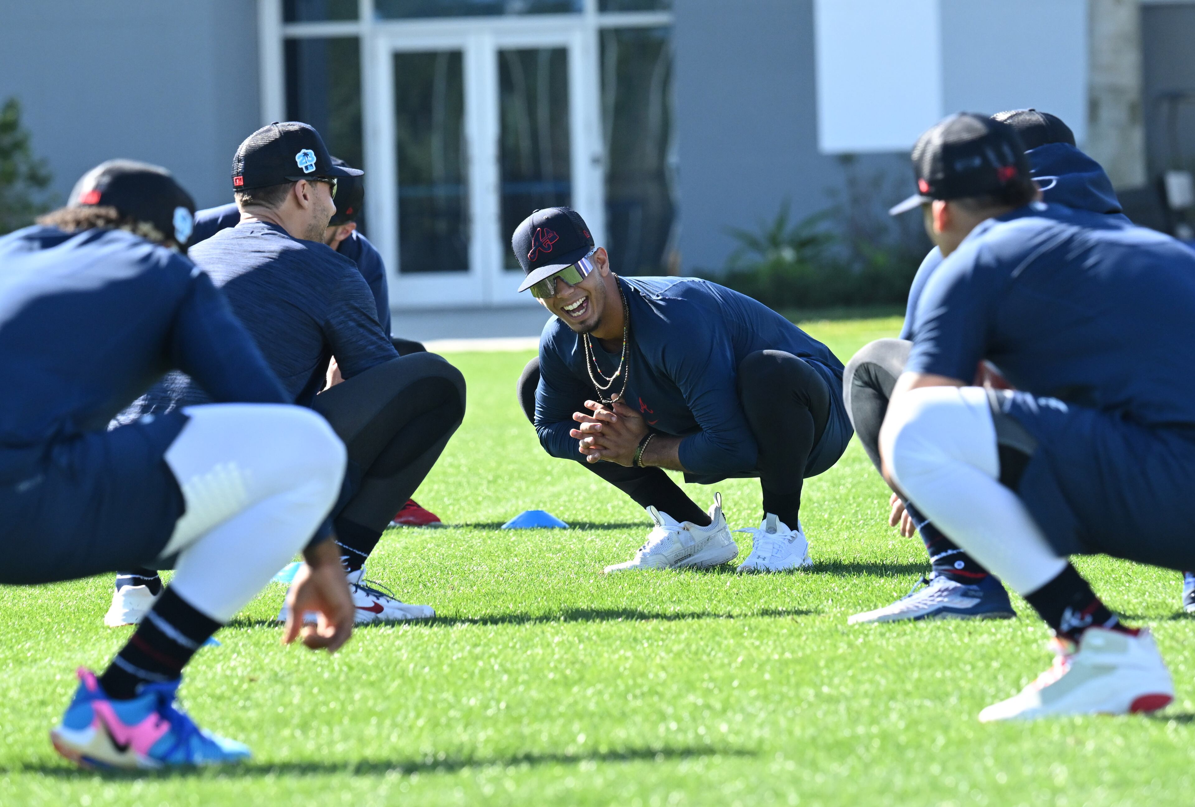 Braves infielder Vaughn Grissom smiles as he and his teammates warm up during spring training Thursday at CoolToday Park in North Port, Florida. (Hyosub Shin / Hyosub.Shin@ajc.com)