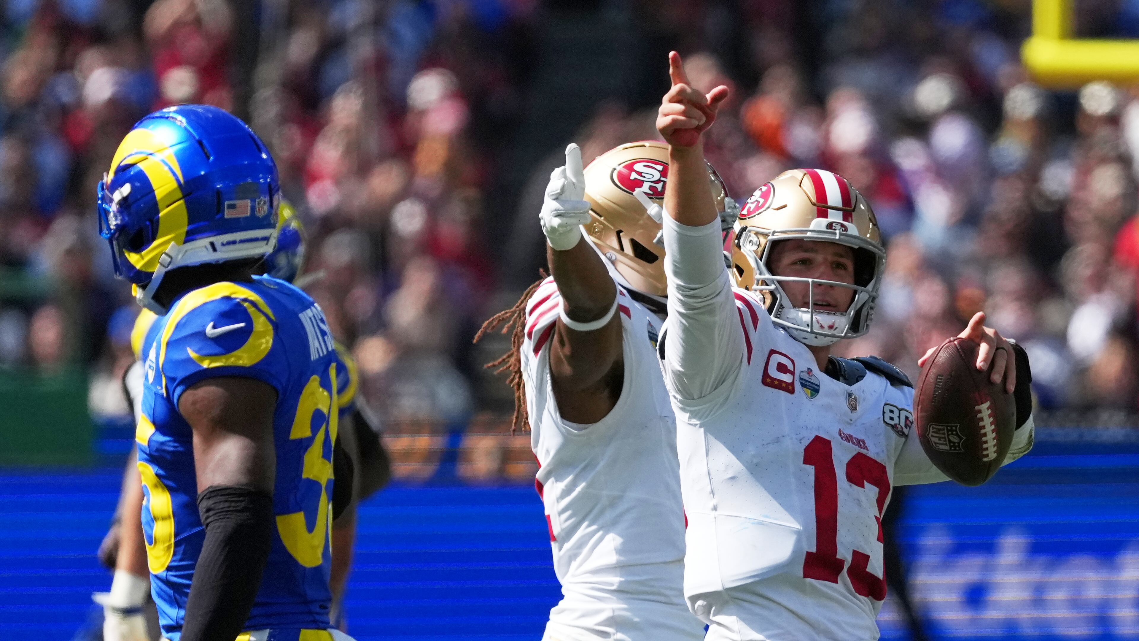 San Francisco 49ers quarterback Brock Purdy celebrates after a runs against the Los Angeles Rams during the second half of an NFL football game, Friday, Sept. 11, 2026, in Melbourne, Australia. (AP Photo/Asanka Brendon Ratnayake)
