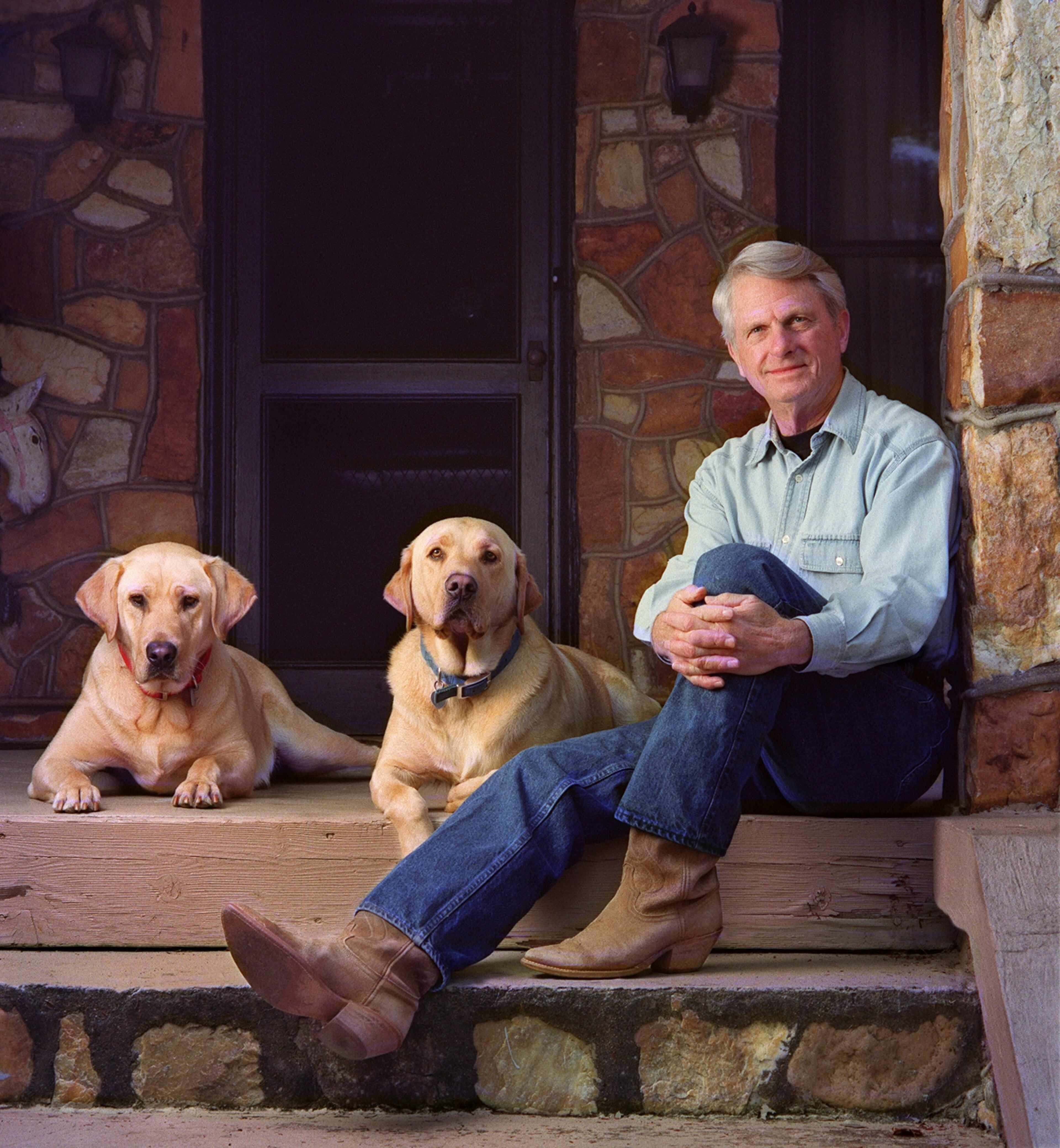 001102 - YOUNG HARRIS, GA -- US Senator and former Georgia Governor Zell Miller (cq) on the porch of the home his mother built in Young Harris, GA with the two family yellow labs, Gus (cq), at left in red collar, and Woodrow(cq) at right in blue collar. Shot Thursday, November 2, 2000 . (KIMBERLY SMITH/AJC staff)