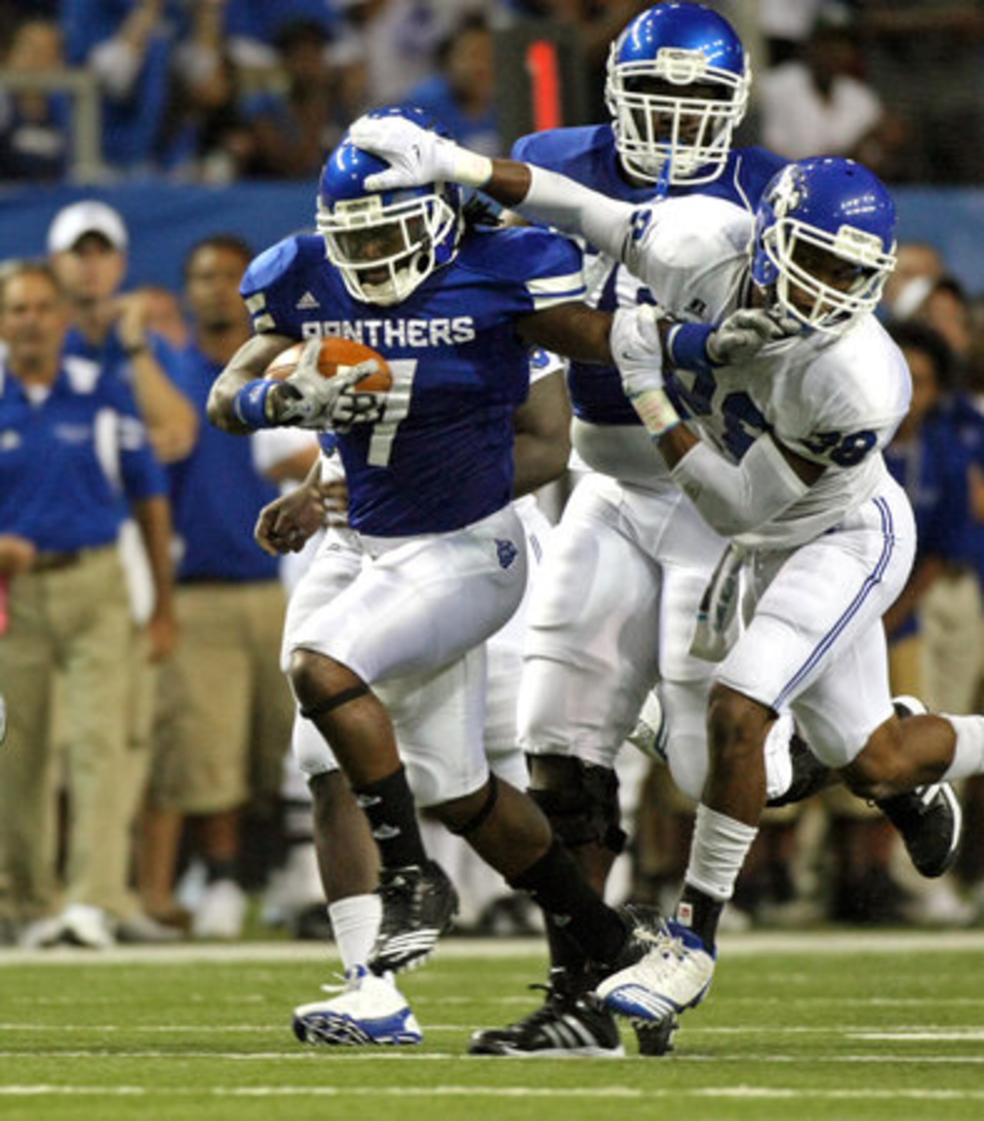 GSU running back Parris Lee (7) fights for extra yardage as he is brought down by Shorter defender Mason Strickland (28) after a long run in the second quarter of their game against Shorter College in the Georgia Dome Thursday night in Atlanta, Ga., Sept. 2, 2010.