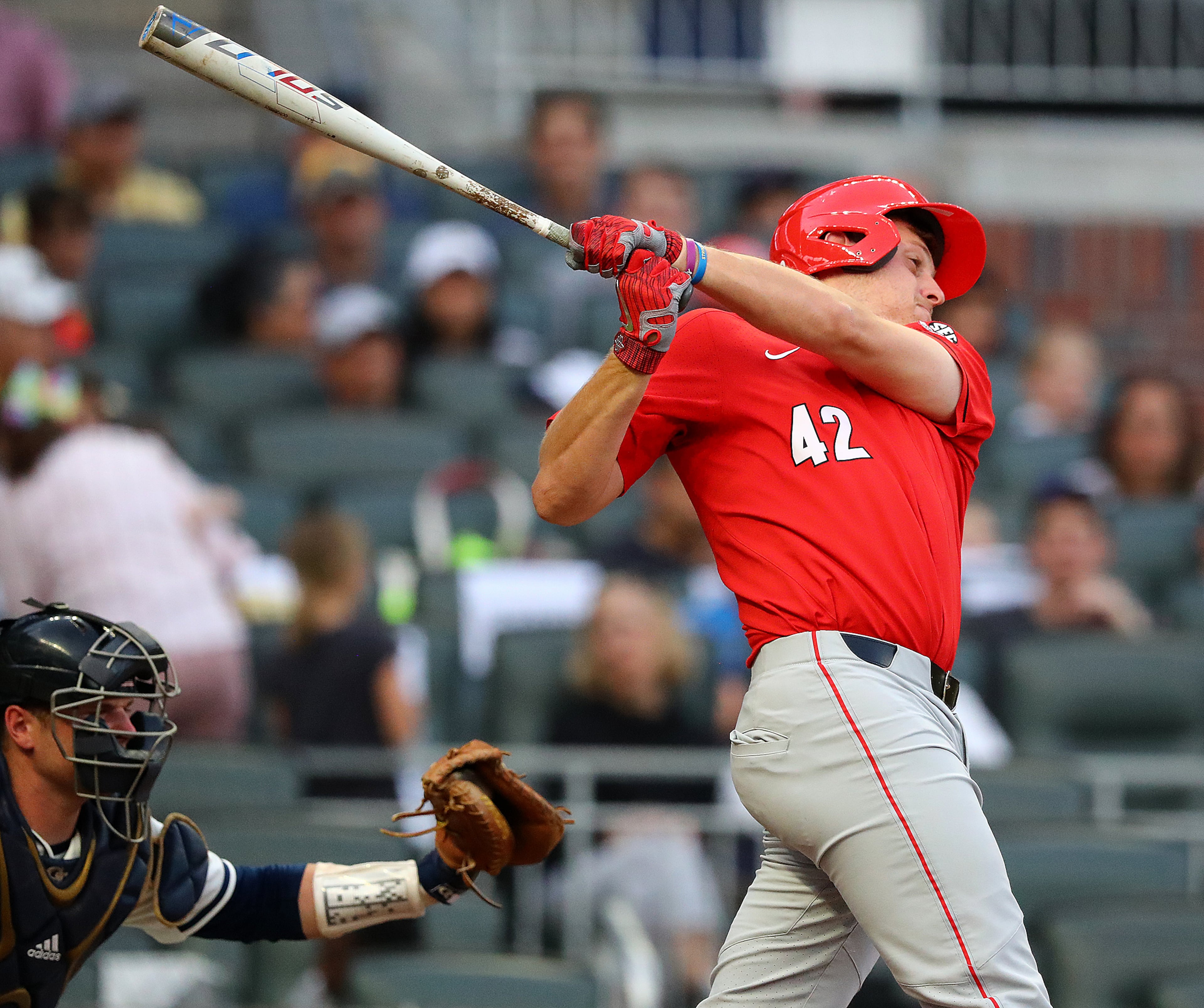 April 23, 2019 Atlanta: Georgia designated hitter John Cable hits a 2-RBI home run to take a 2-1 lead over Georgia Tech during the second inning in the Spring Classic NCAA college baseball game at SunTrust Park on Tuesday, April 23, 2019, in Atlanta. Curtis Compton/ccompton@ajc.com