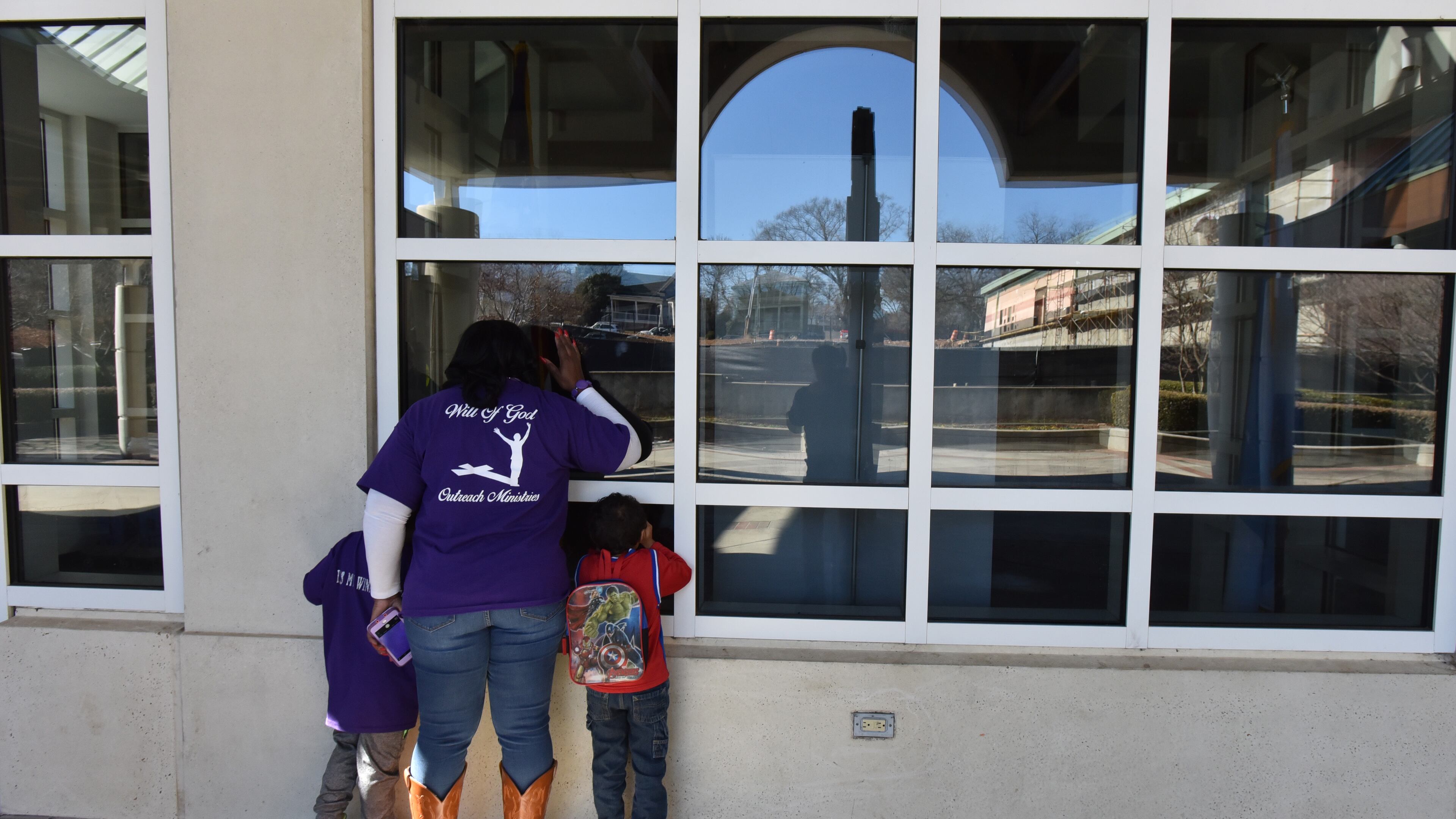 Visitors peek into a window at the visitor’s center after they found out sites at the Martin Luther King Jr. National Historic Park were closed after Congress failed to avert a government shutdown on Saturday, January 20, 2018. Many federal government services ground to halt and some historic attractions - including Martin Luther King Jr.'s childhood home - were closed in Georgia on Saturday.