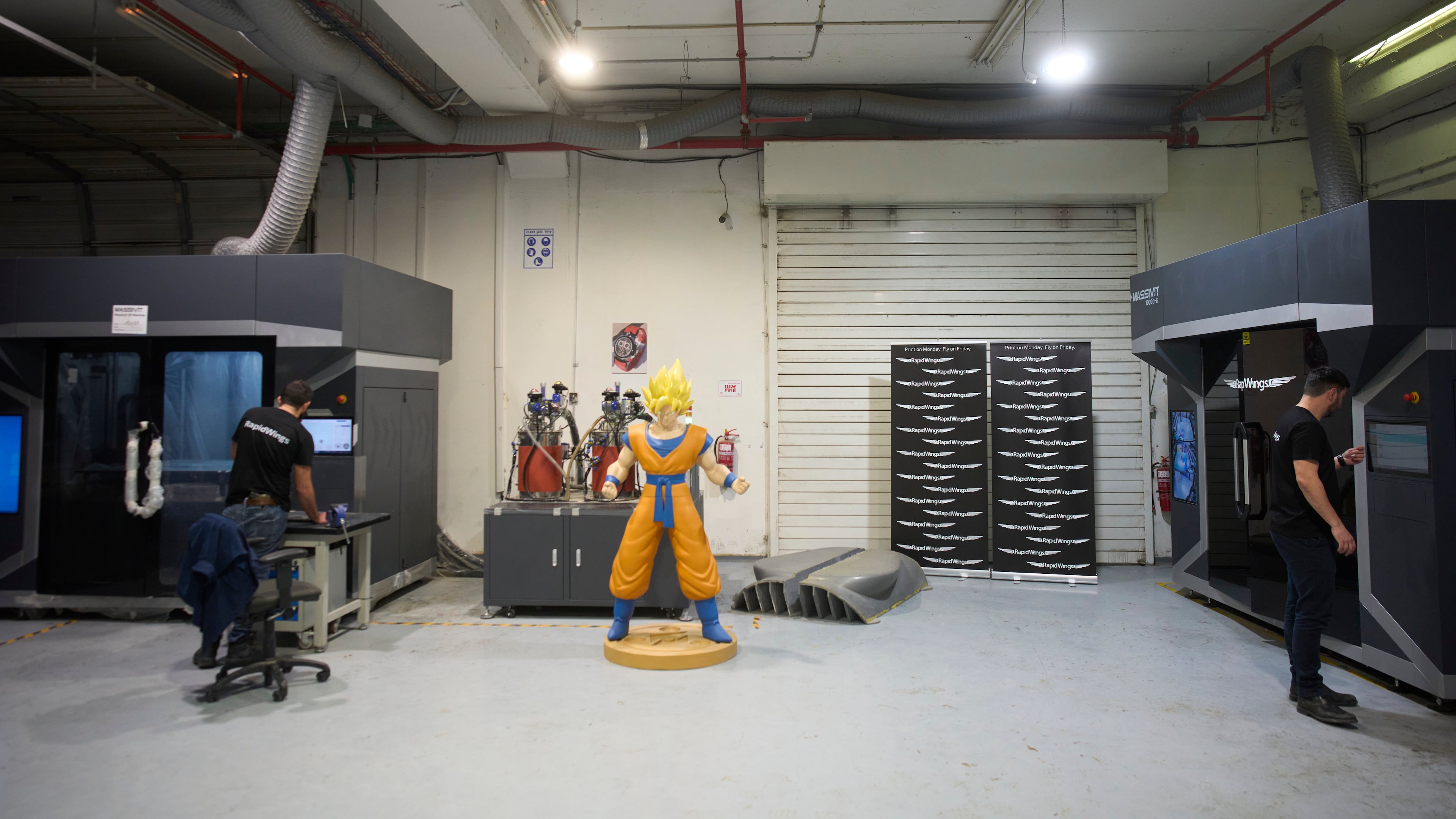 Workers operate a 3D printer that makes drone parts at the headquarters of Masssivit in Lod, Israel, March 30, 2026. (AP Photo/Ohad Zwigenberg)
