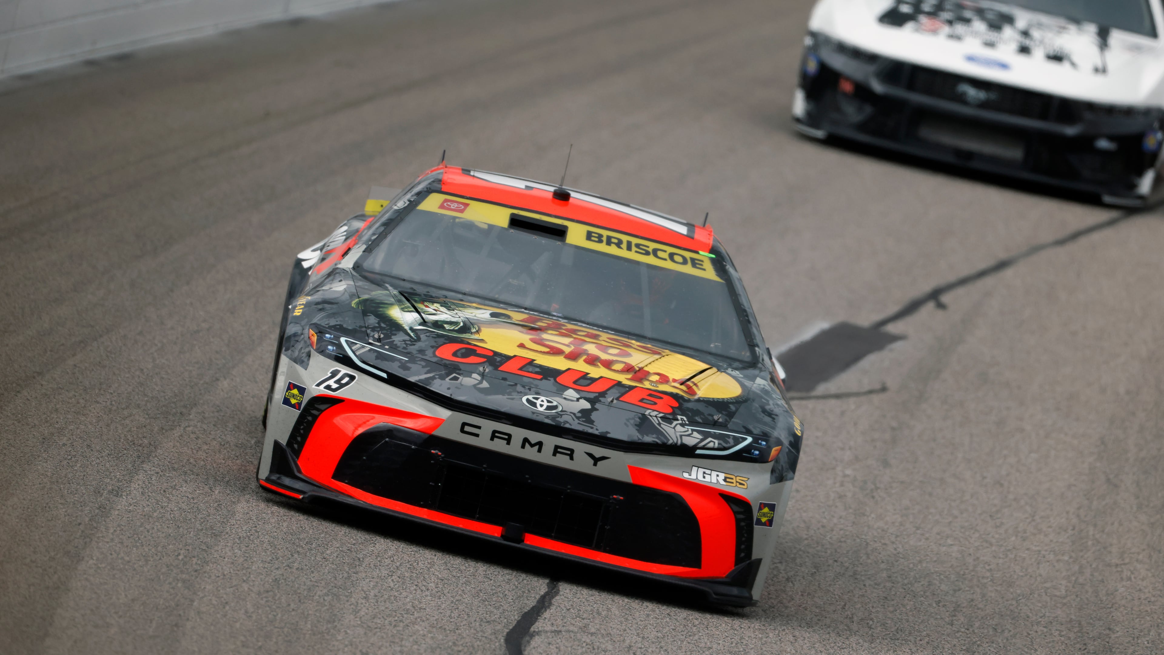 Chase Briscoe (19) heads through Turn 1 during a NASCAR Cup Series auto race in Kansas City, Kan., Sunday, Sept. 27, 2026. (AP Photo/Colin E. Braley)