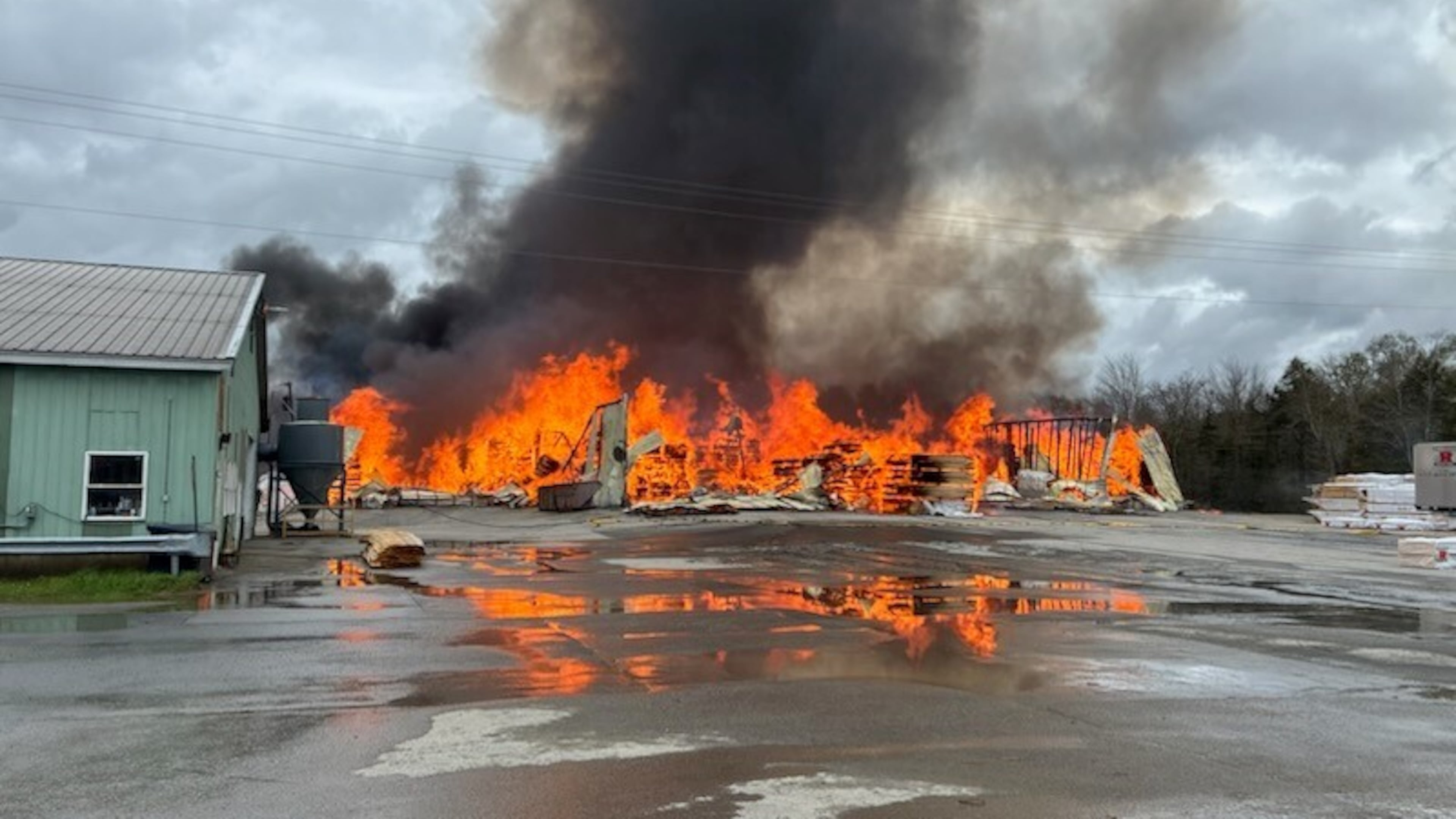 This photo provided by the Maine Department of Public Safety shows flames from a large fire at Robbins Lumber in Searsmont, Maine on Friday, May 15, 2026 (Maine Department of Public Safety via AP)