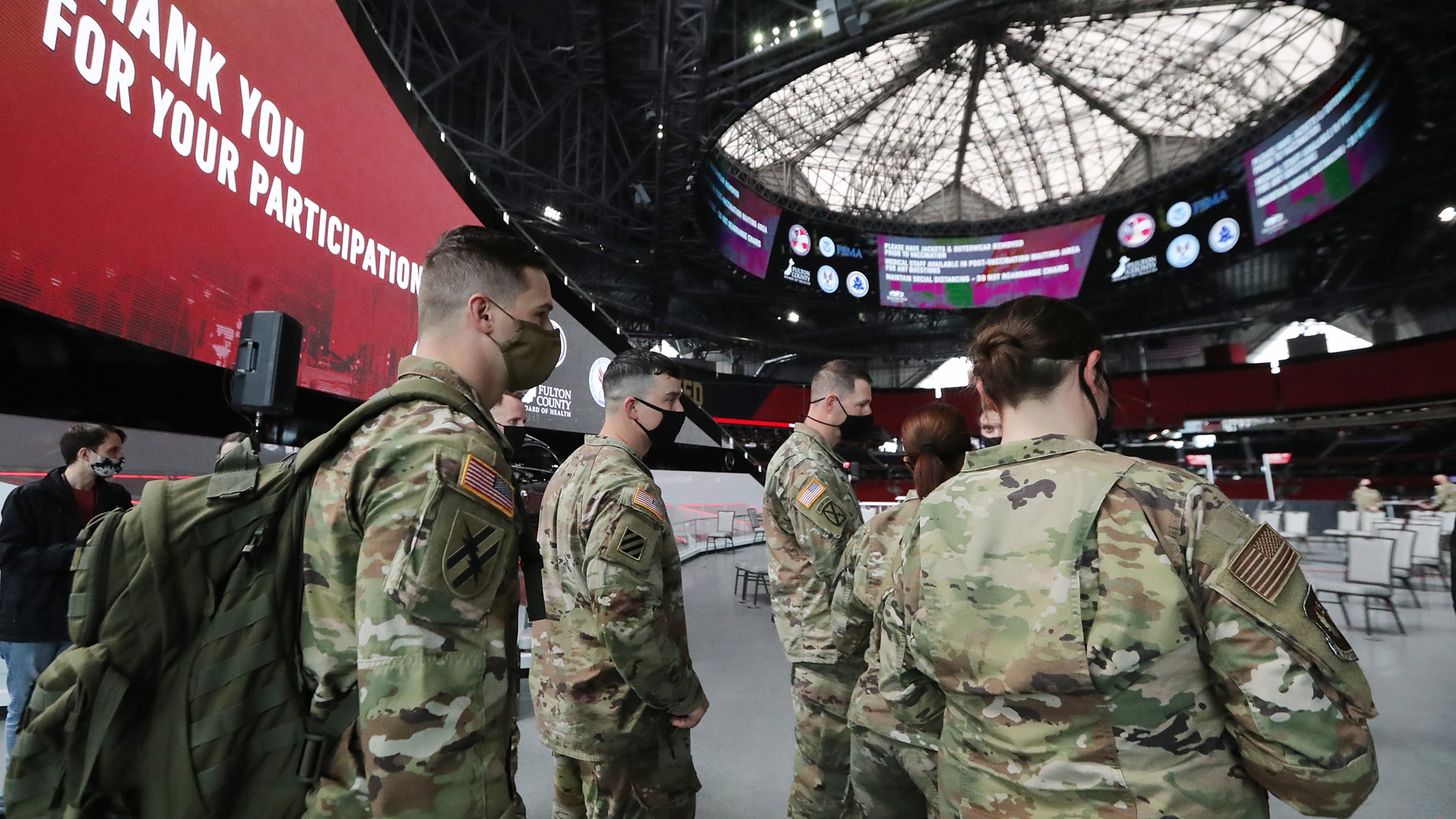 032321 Atlanta: Some of the 222 U.S. Army troops gear up at Mercedes-Benz Stadium as operations get under way for the facility to become the largest Community Vaccination Center in the southeast serving an average of 42,000 citizens a week on Tuesday, March 23, 2021, in Atlanta. There are 202 soldiers from Fort Stewart and twenty U.S. Army medical specialists that will operate some of the vaccination areas located inside Mercedes-Benz Stadium. “Curtis Compton / Curtis.Compton@ajc.com”