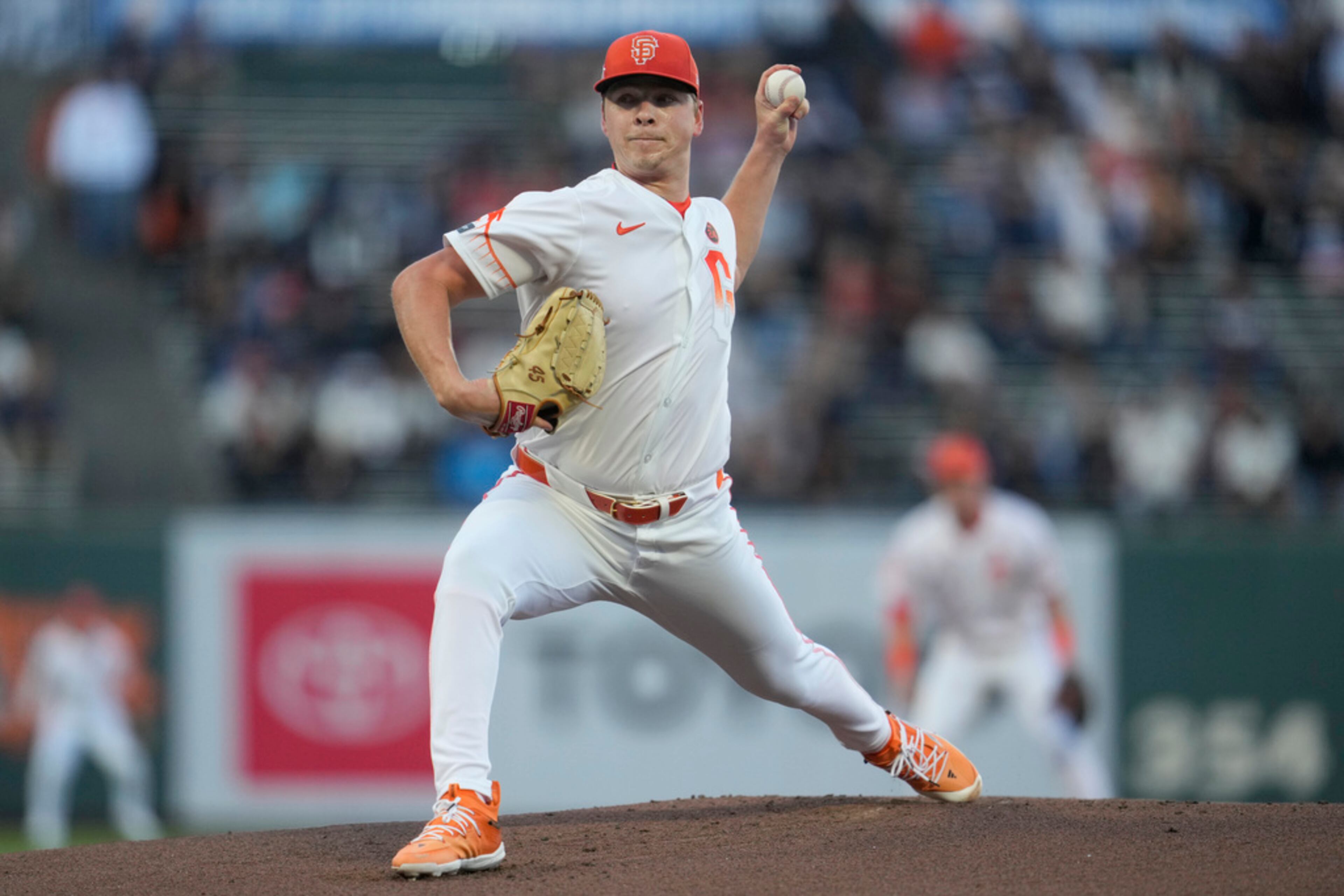 San Francisco Giants pitcher Kyle Harrison works against the Atlanta Braves during the first inning of a baseball game in San Francisco, Tuesday, Aug. 13, 2024. (AP Photo/Jeff Chiu)