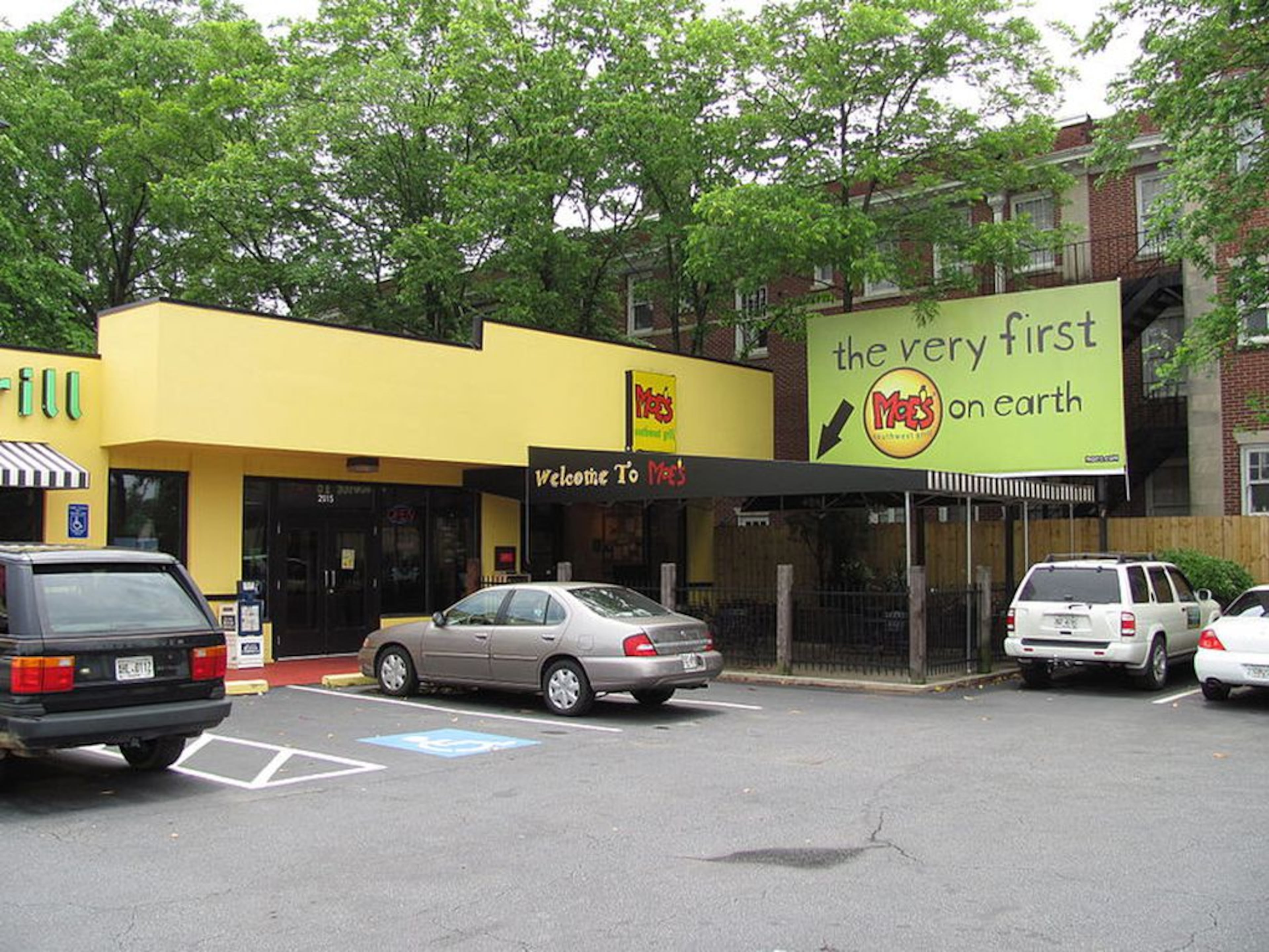 The original Moe’s is a yellow building in Buckhead marked by a large sign proclaiming it “the very first Moe’s on earth.” (File Photo)