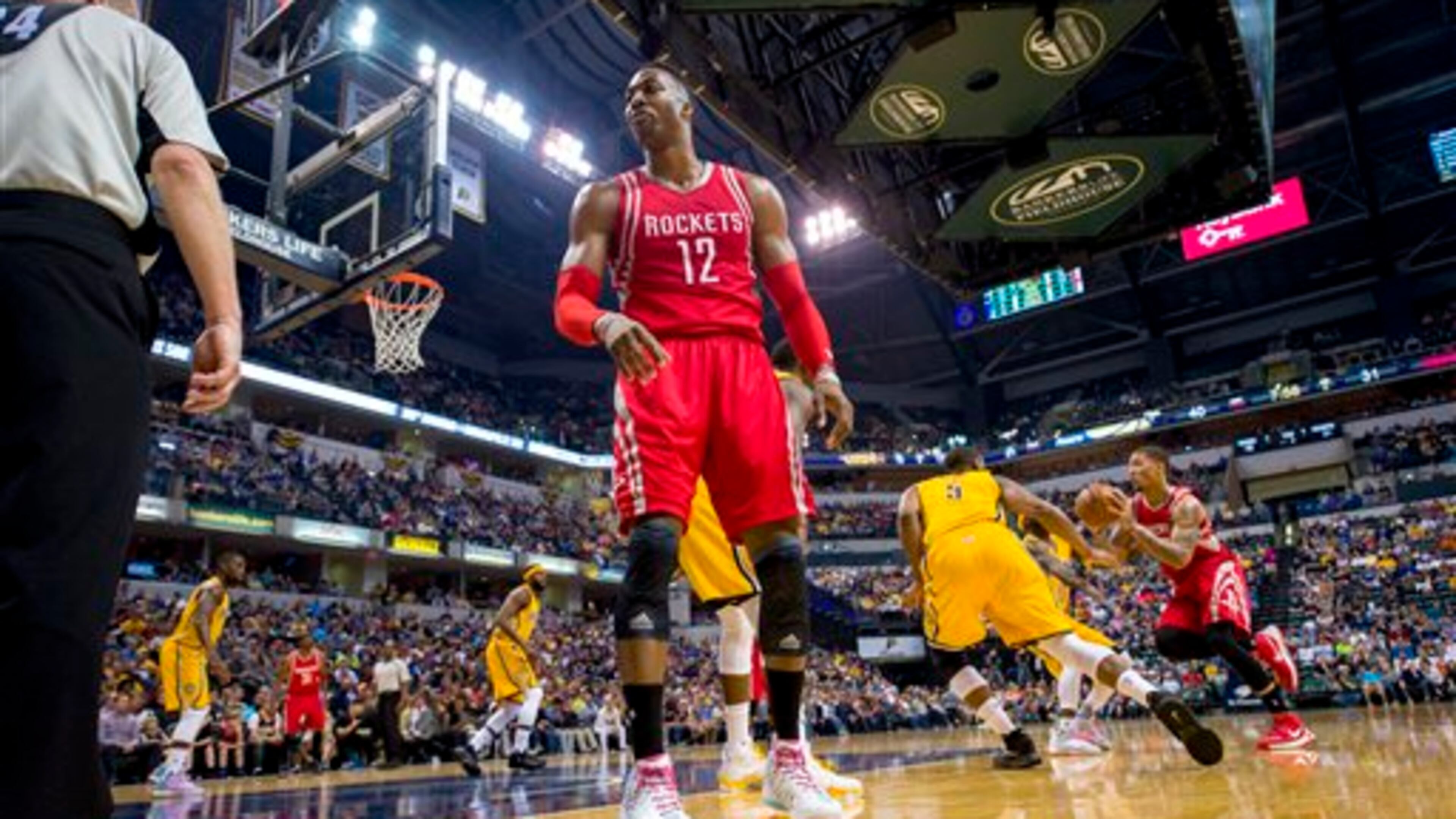 Houston Rockets center Dwight Howard (12) turns to complain toward an official after believing he had been fouled during an NBA basketball game against the Indiana Pacers, Sunday, March 27, 2016, in Indianapolis. The Pacers won 104-101. (AP Photo/Doug McSchooler)