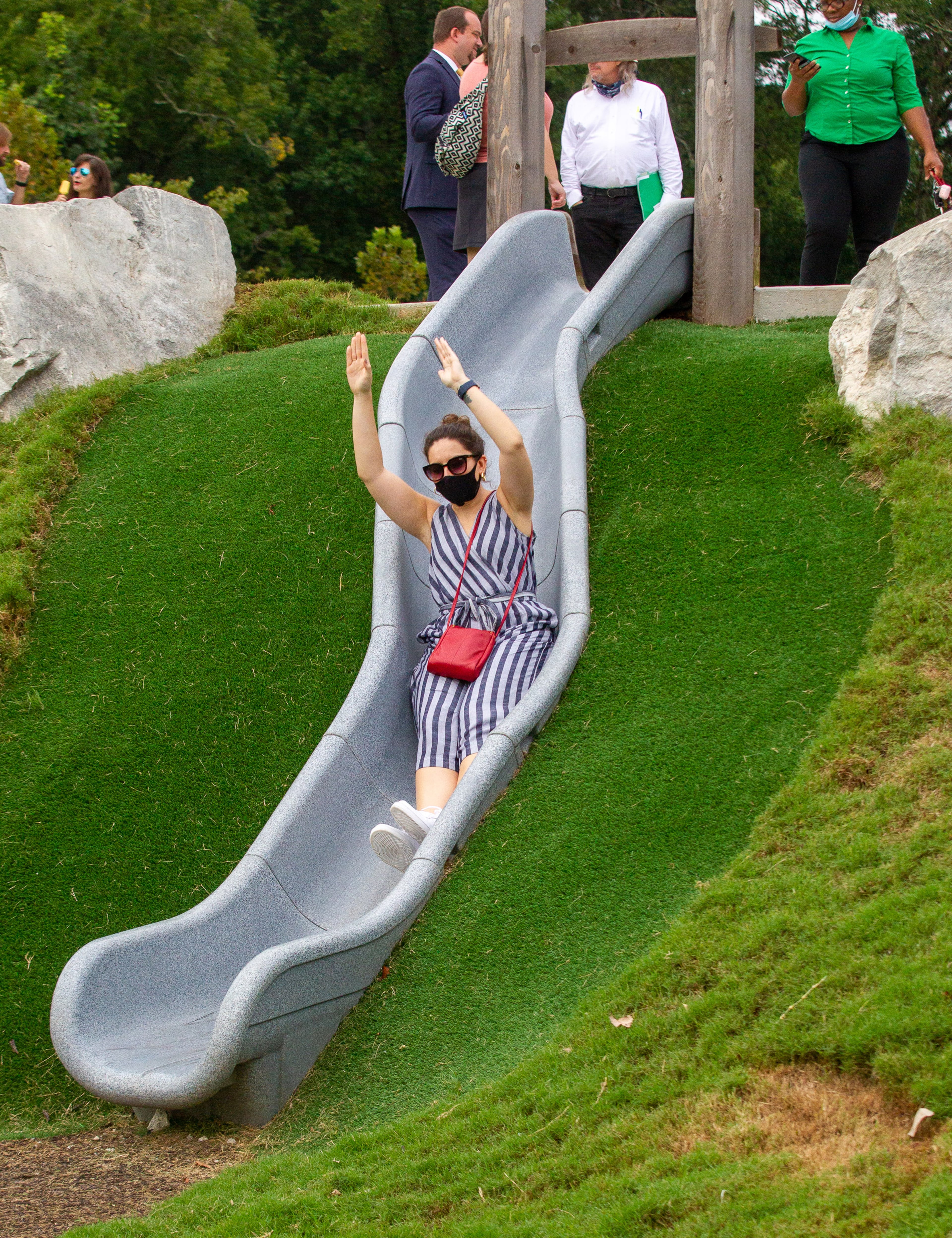 Jen Treman rides down one of the park slides after the public opening of Atlanta's largest planned greenspace, the Westside Park, Friday, August 20, 2021. STEVE SCHAEFER FOR THE ATLANTA JOURNAL-CONSTITUTION