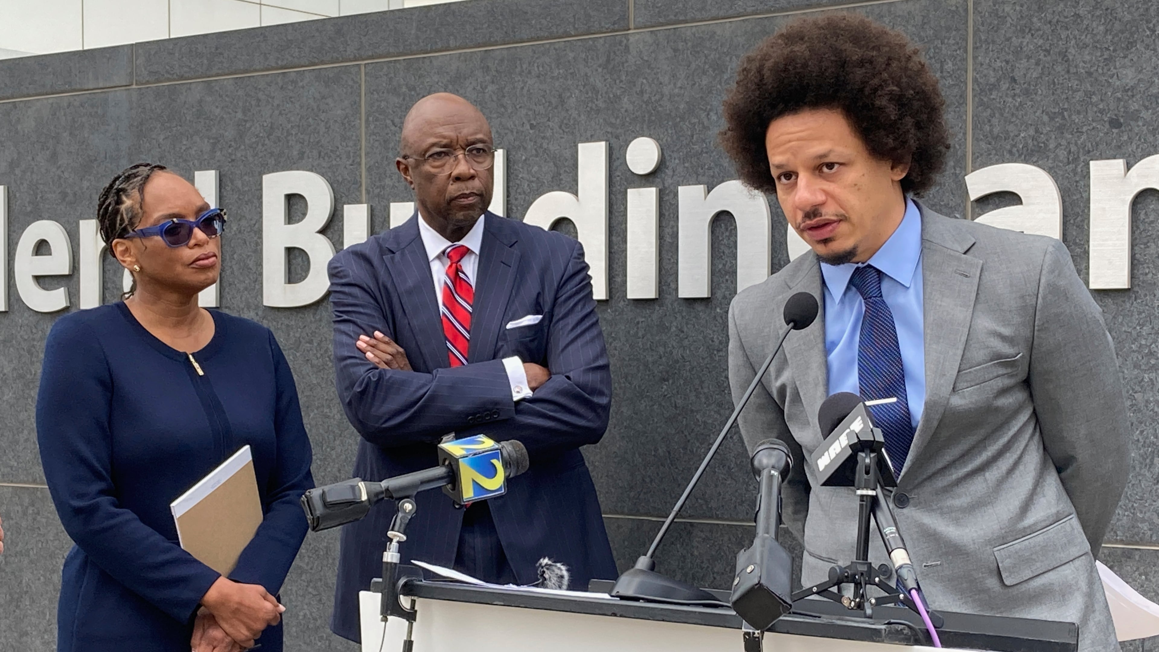 FILE - Comedian Eric André, right, speaks at a news conference outside the federal courthouse in Atlanta on Oct. 11, 2022, as his attorneys Allegra Lawrence-Hardy, left, and Richard Deane watch. (AP Photo/Kate Brumback, File)