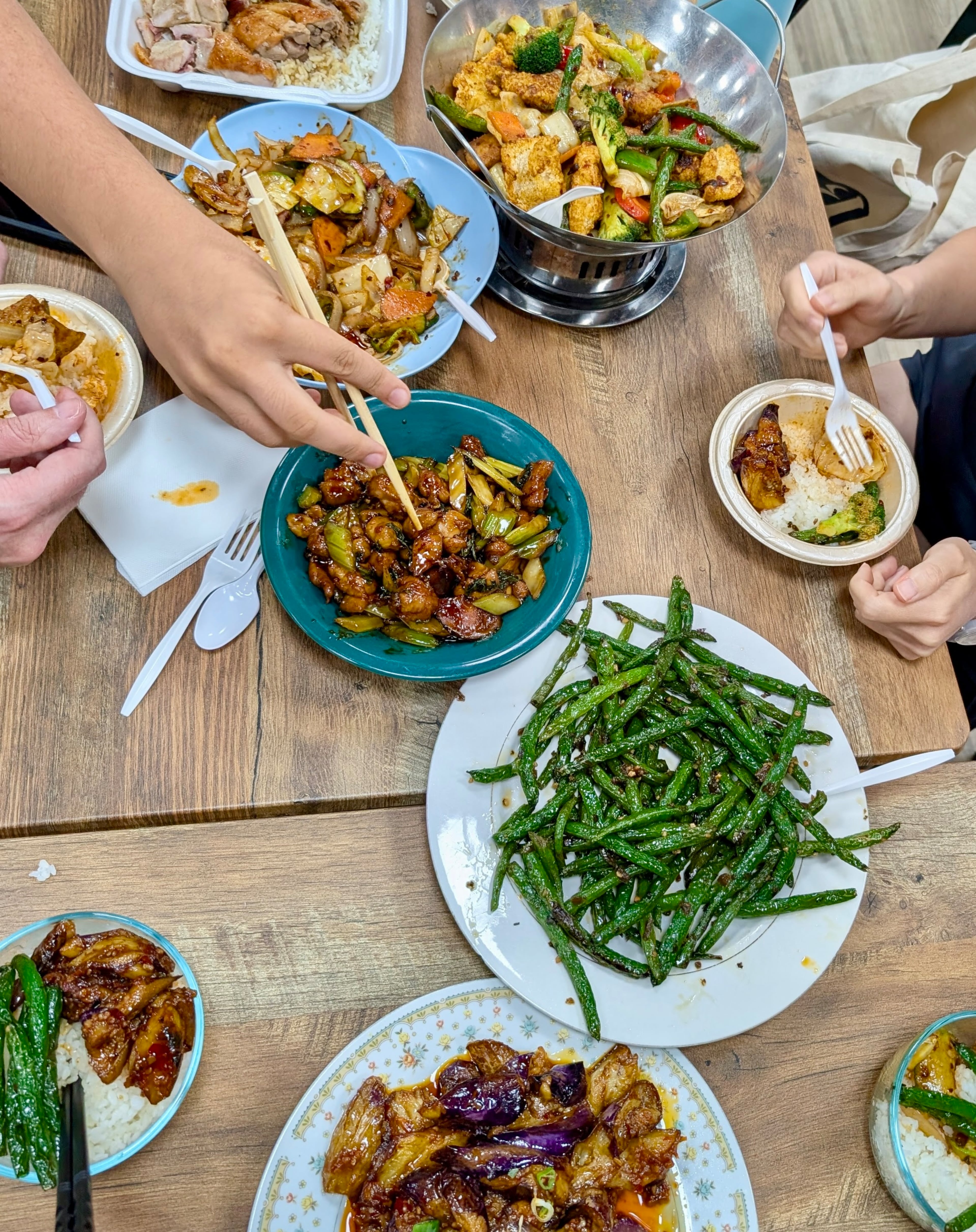 A table full of food from China Kitchen in Chamblee. (Su-Jit Lin for the AJC)