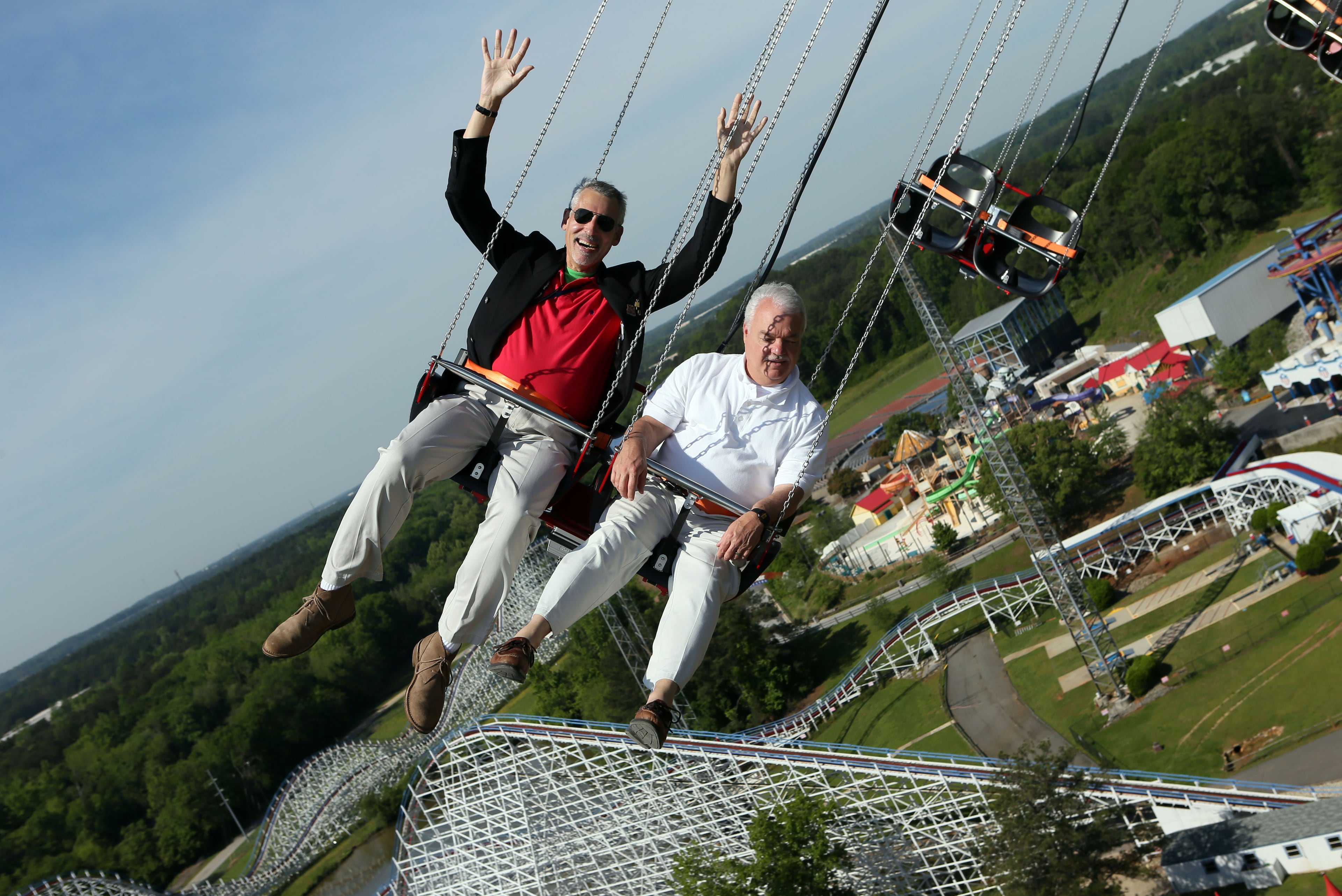 AJC's Tom Kelley (left) & Tim Lyon ride the new 24 story tall SkyScreamer extreme swing ride at Six Flags Over Georgia in Austell during a preview event on Thursday May 9th, 2013. PHIL SKINNER / PSKINNER@AJC.COM
