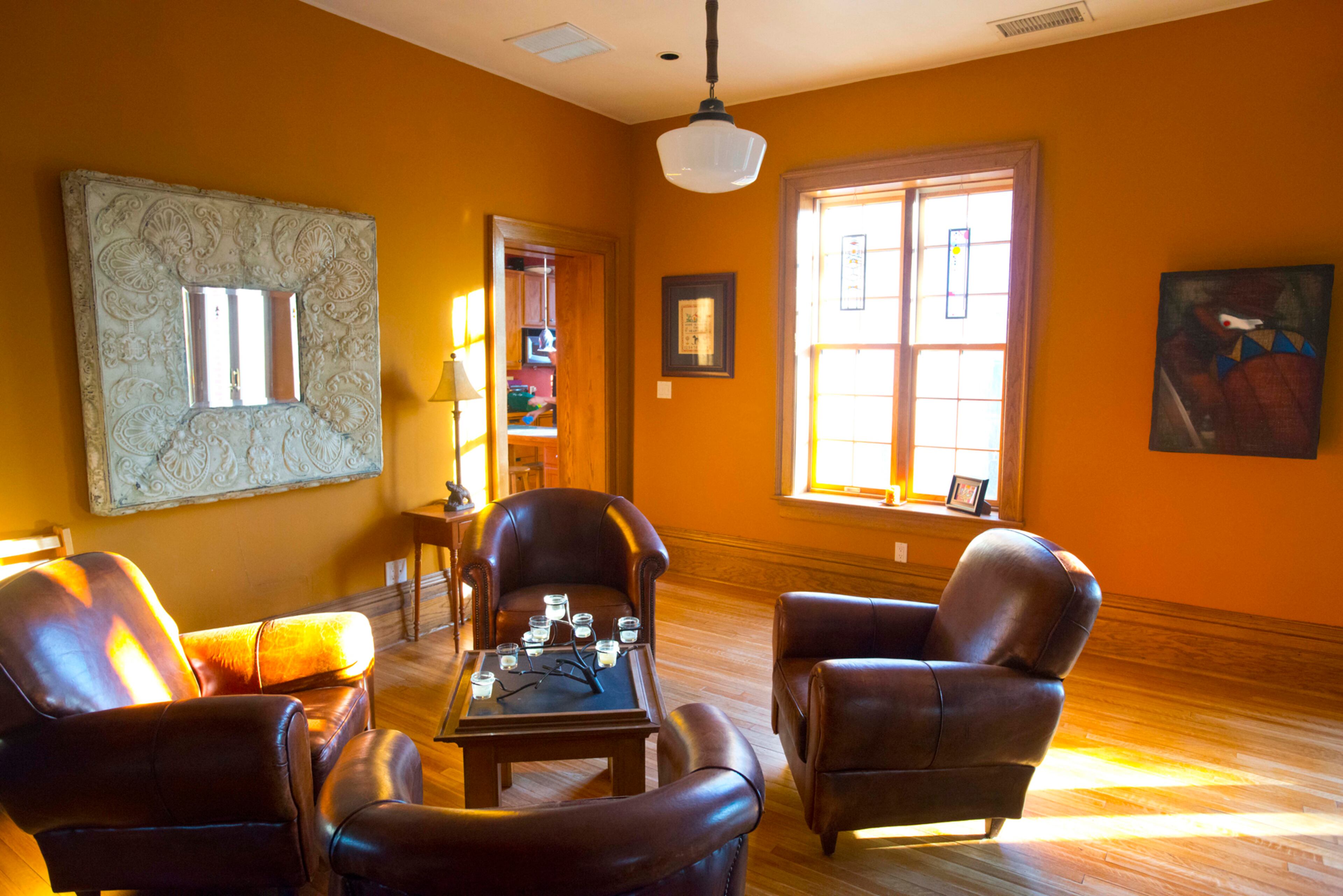 This table is crafted out of an old chalkboard once used at the University of Wisconsin. The couple says their favorite furniture piece is a library table they bought at an auction and now use as the dining table, which seats at least 12. The table has a red leather insert in the middle, and the wood matches the bookshelves. “It looks like it was supposed to be here all the time,” Brazee says.