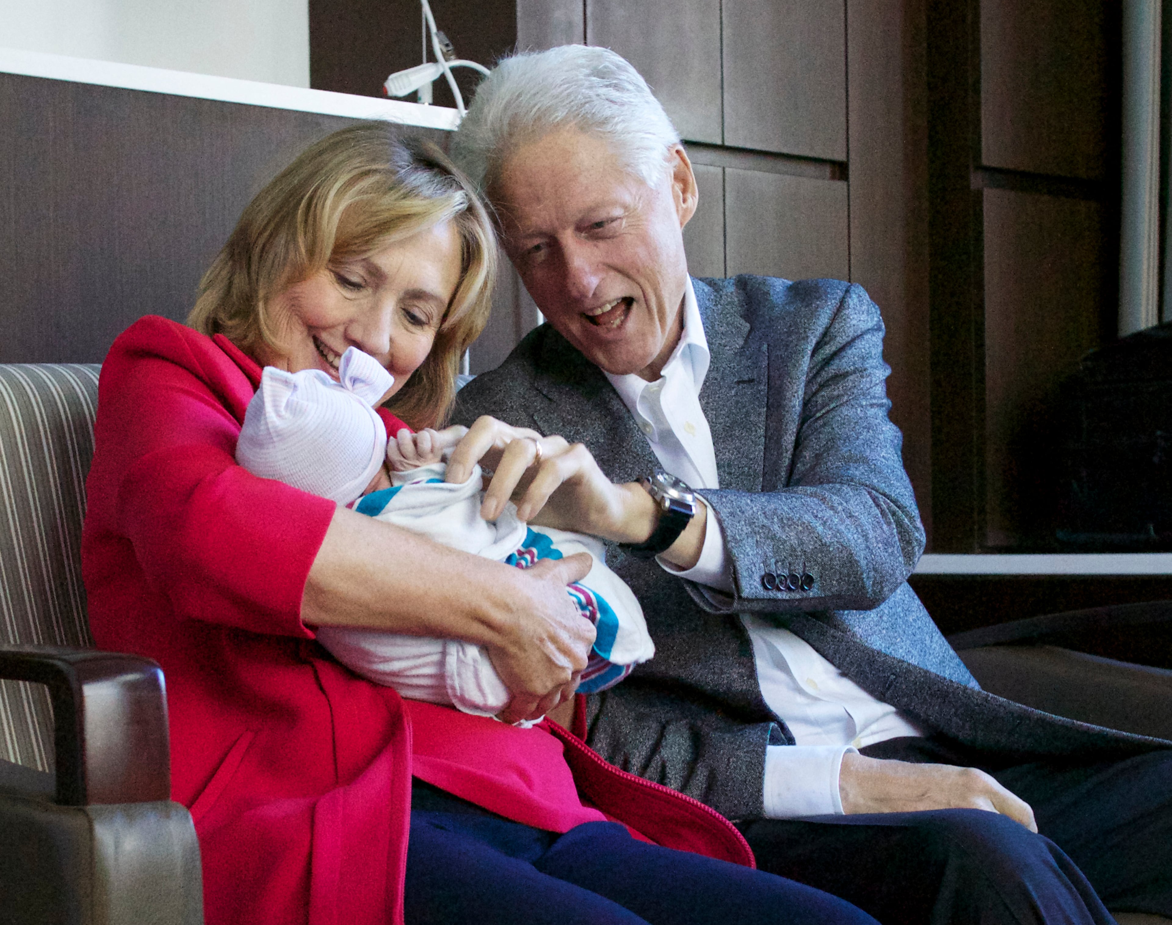 This photo provided by Clinton spokesman Kamyl Bazbaz shows former Secretary of State Hillary Rodham Clinton, left, and former President Bill Clinton, right with their granddaughter Charlotte Clinton Mezvinsky on Saturday, Sept. 27, 2014, at Lenox Hill Hospital in New York. The Clintons's daughter, Chelsea, gave birth Friday night to her first child, Charlotte. (AP Photo/Office of President Clinton, Jon Davidson)