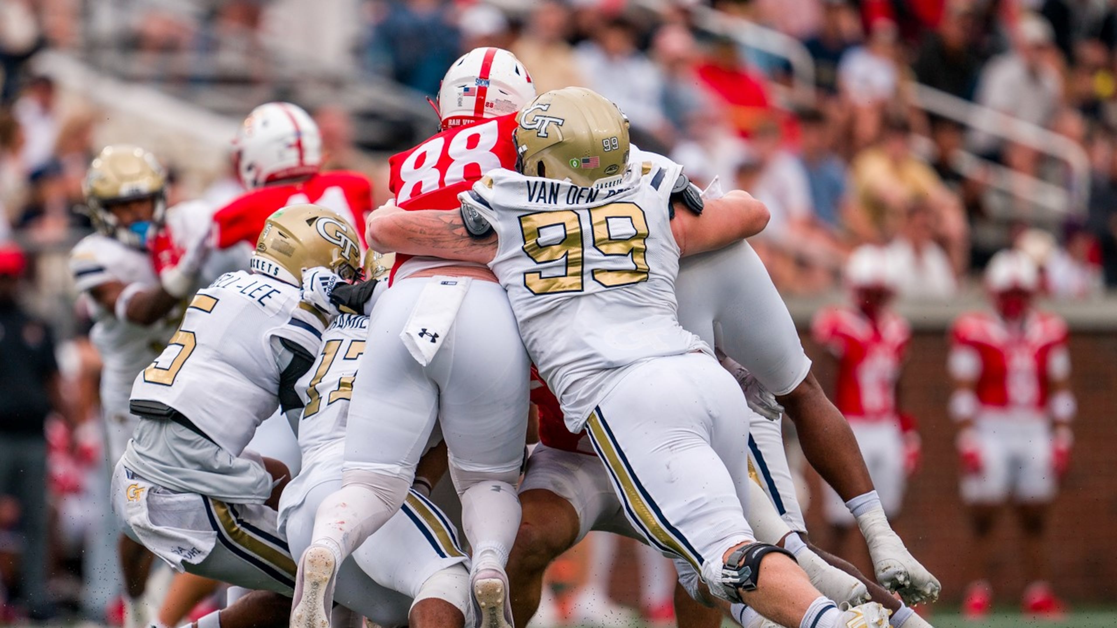 Georgia Tech defensive lineman Jordan van den Berg (right) — pictured assisted on a tackle against VMI in 2024 — had 44 tackles, including 11 for a loss, and three sacks for the Yellow Jackets last season. (Danny Karnik/Georgia Tech Athletics)