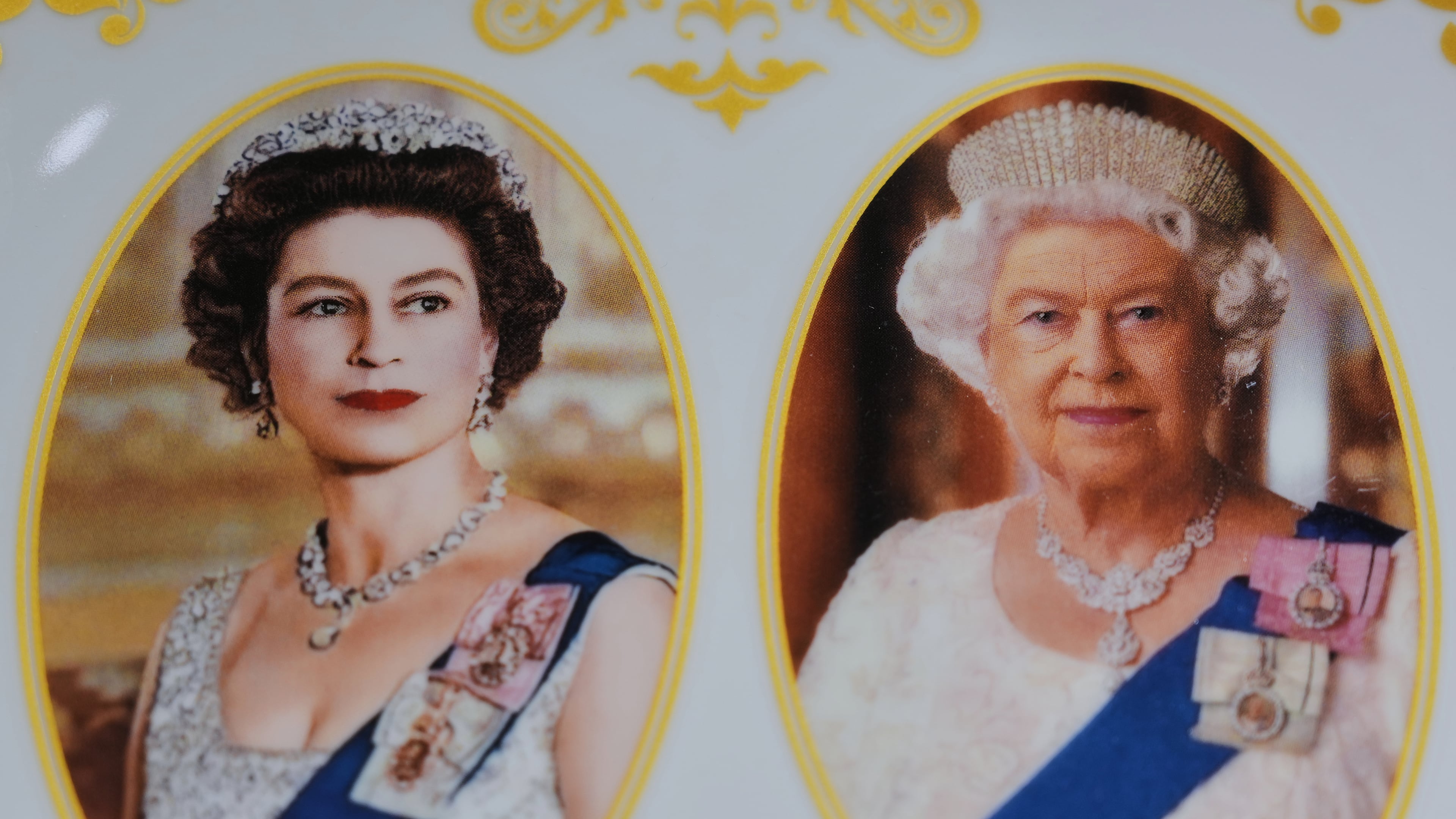 A plate with photos of late Queen Elizabeth II is on display for sale at a souvenirs shop in London, on April 17, 2026. (AP Photo/Kin Cheung)