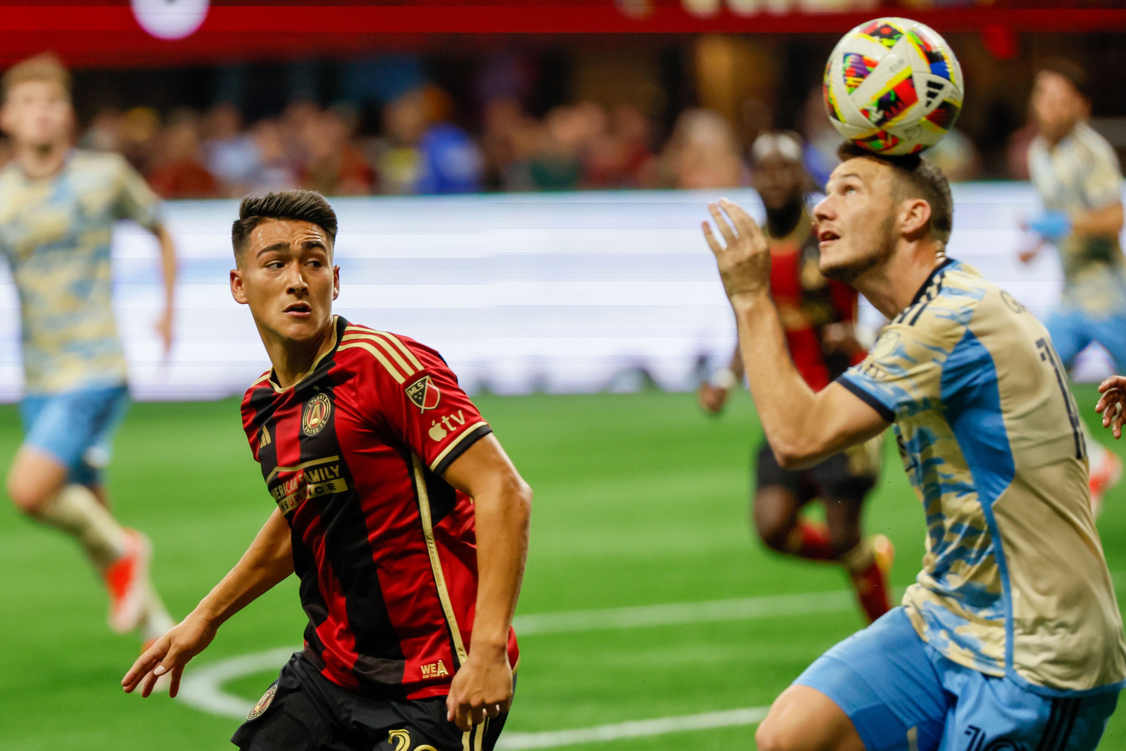 Atlanta United forward Tyler Wolff (28) looks on as Philadelphia Union midfielder Déniel Gazdag (10) tries to deflect the ball. Miguel Martinez / miguel.martinezjimenez@ajc.com