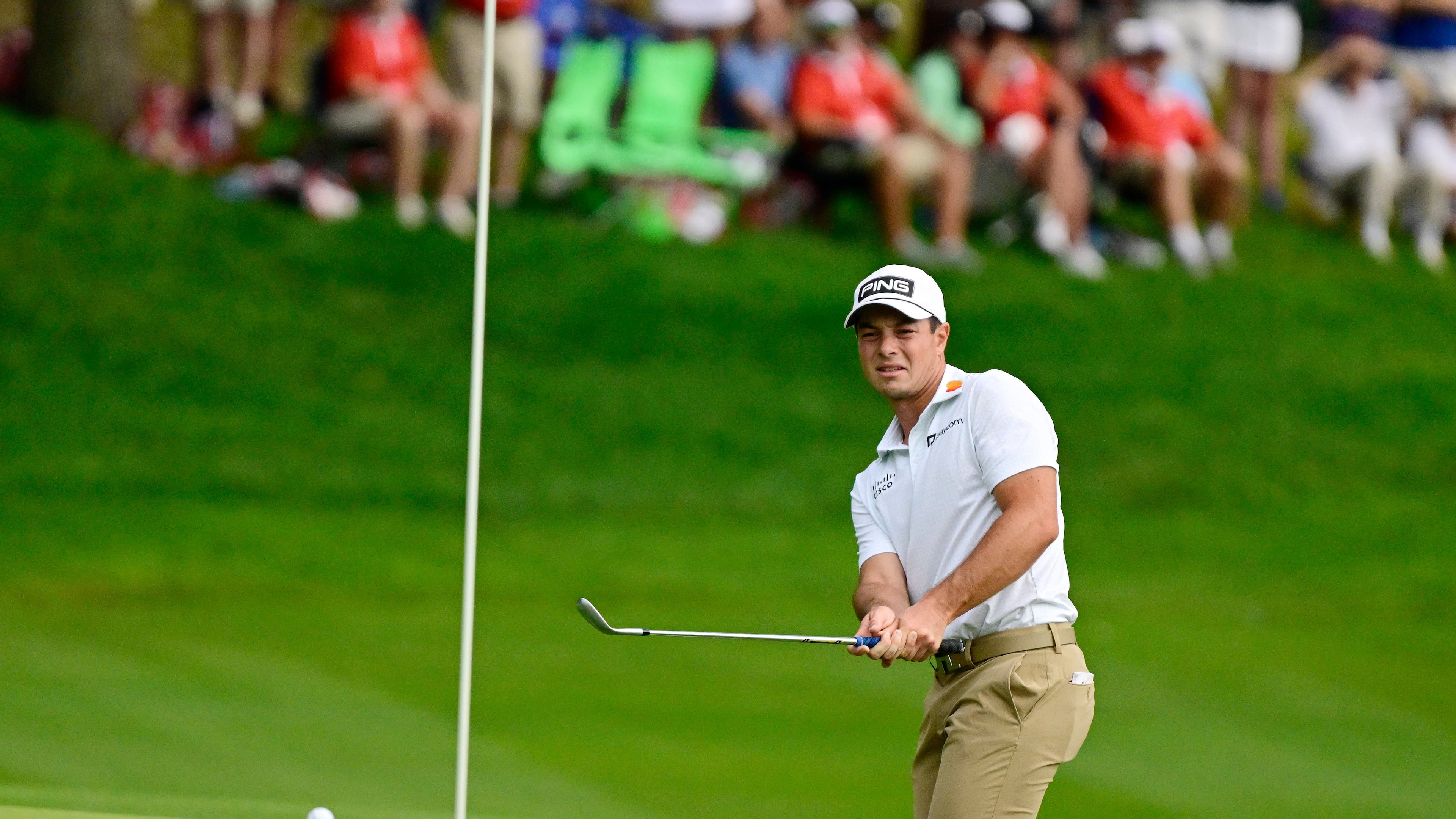Viktor Hovland, of Norway, watches his shot land near the pin on the 15th green during the third round of the Travelers Championship golf tournament at TPC River Highlands, Saturday, June 27, 2026, in Cromwell, Conn. (AP Photo/Jessica Hill)