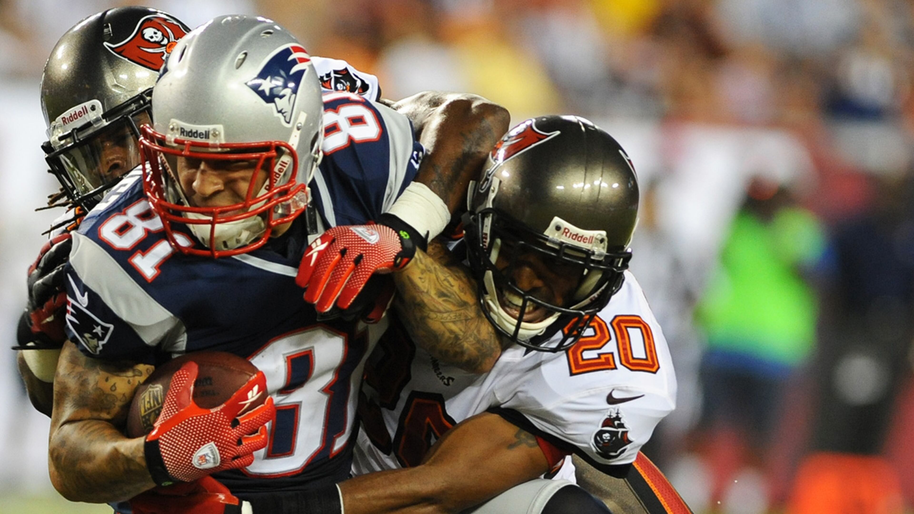 Defensive back Ronde Barber #20 of the Tampa Bay Buccaneers #20 tackles tight end Aaron Hernendez #81 of the New England Patriots at Raymond James Stadium in a pre-season game August 24, 2012 in Tampa, Florida. (Photo by Al Messerschmidt/Getty Images)