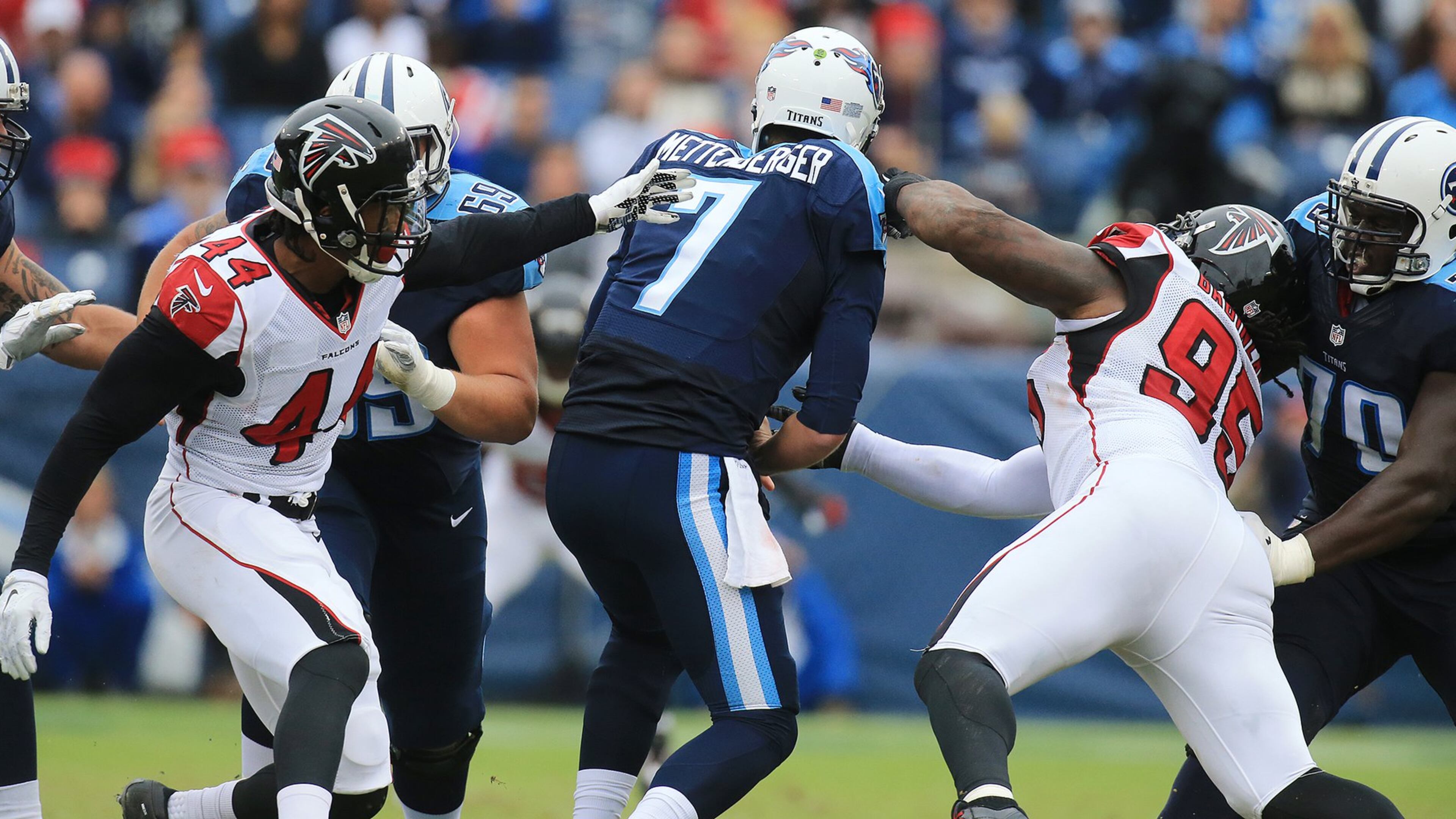 102515 NASHVILLE: — Falcons Vic Beasley Jr. (left) and Jonathan Babineaux get some pressure on Titans quarterback Zach Mettenberger during the first half in a football game on Sunday, Oct. 25, 2015, in Nashville. Curtis Compton / ccompton@ajc.com