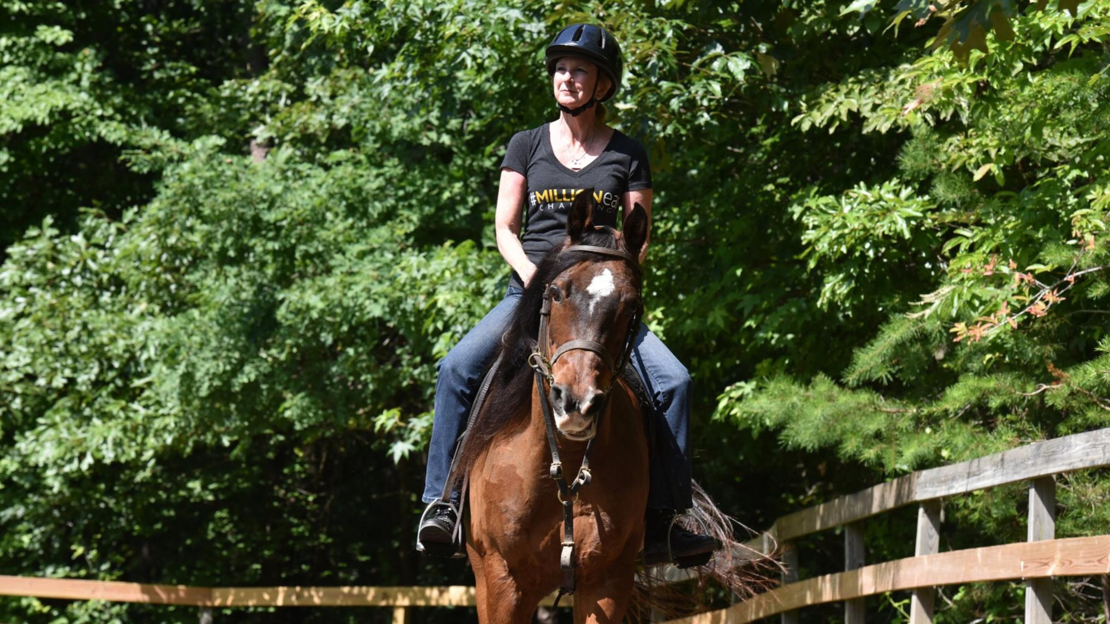 Robin Chisolm-Seymour rides her horse Jabez at her Alpharetta home recently. She began gradually losing her hearing in her 30s — in the 1980s. Ultimately, it kept her from horseback riding, a longtime passion. Thanks to a fitness instructor and cochlear implants, she was once again able to ride horses. HYOSUB SHIN / HSHIN@AJC.COM