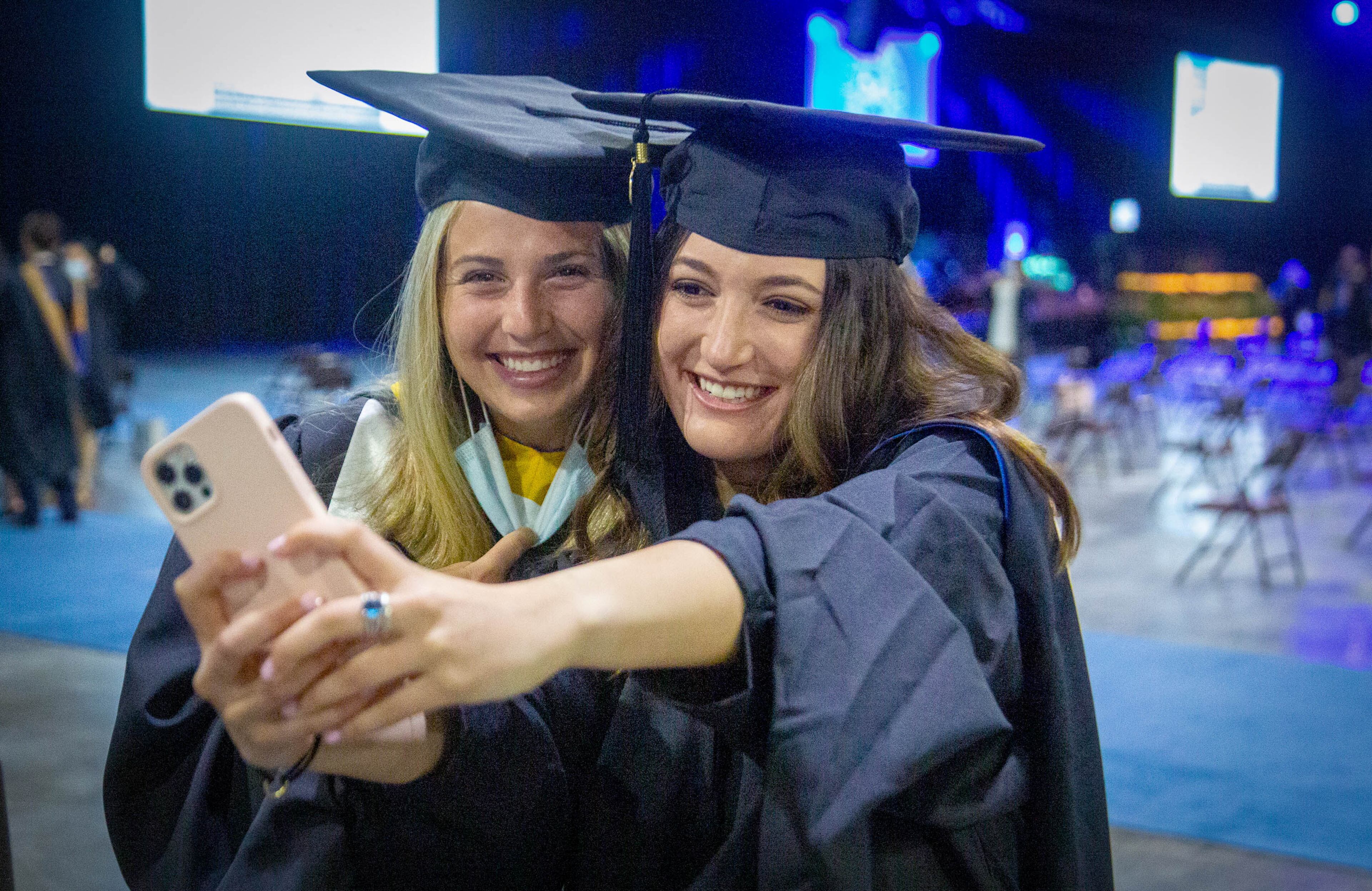 Sami Feller and Jenna Rabinovitch take a selfie before the start of Emory's Goizueta Business Schools graduation ceremony at the World Congress Center Friday, May 14, 2021. STEVE SCHAEFER FOR THE ATLANTA JOURNAL-CONSTITUTION