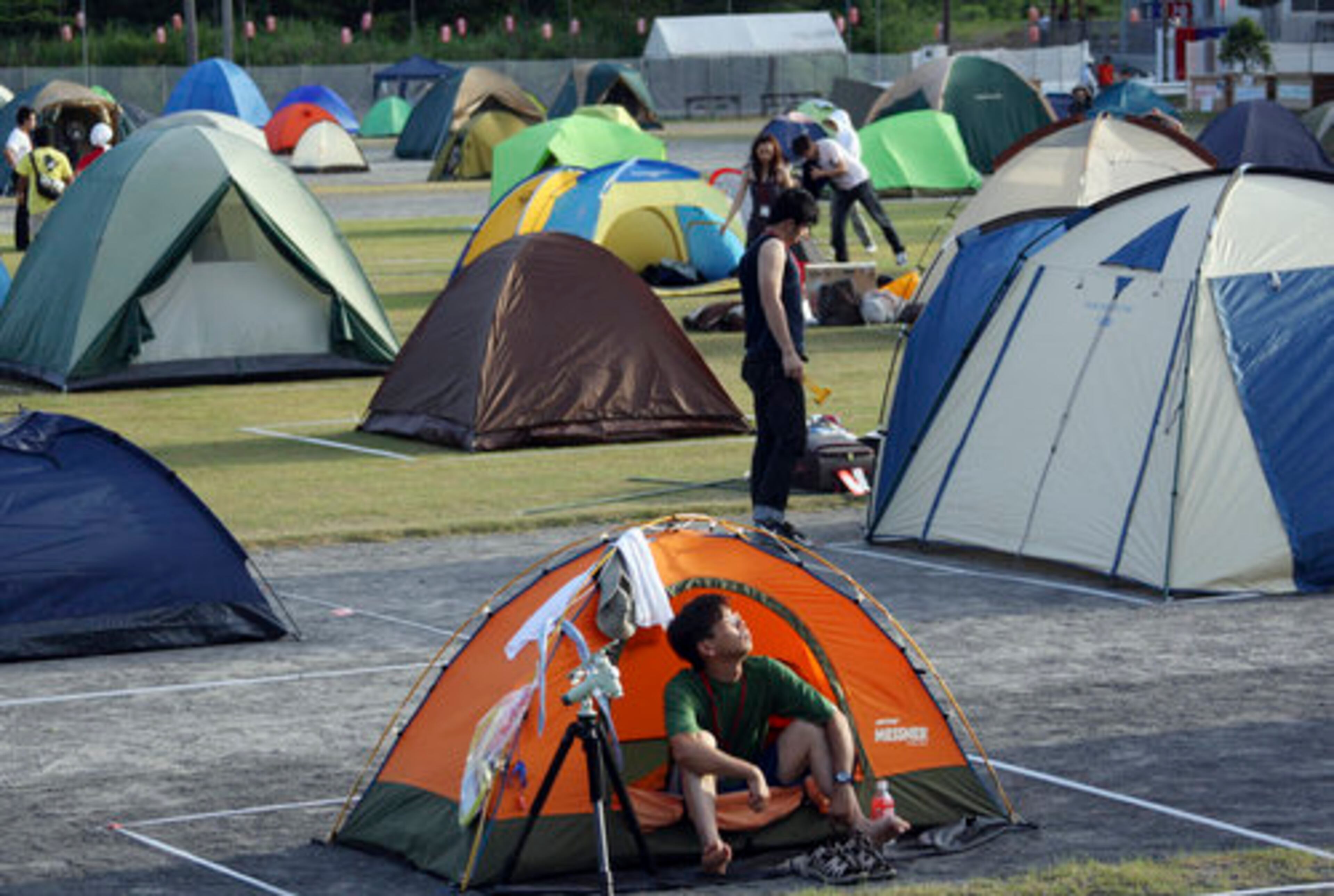 Japanese (above) camped out for the celestial event. In India, even in regions where the eclipse was not visible, pregnant women were advised to stay indoors in curtained rooms over a belief that the sun's invisible rays would harm the fetus and the baby would be born with disfigurations, birthmarks or a congenital defect.