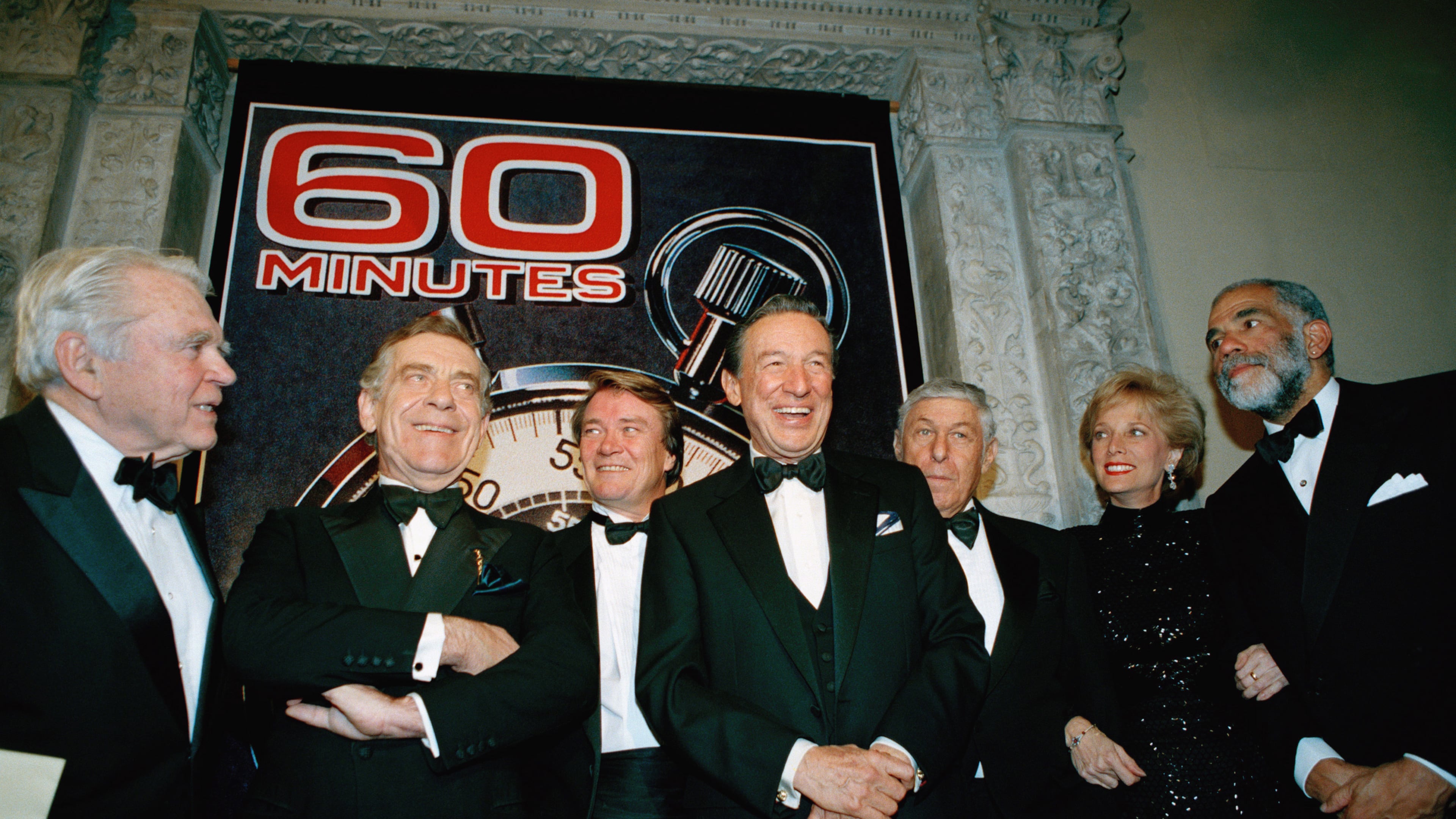 FILE - The "60 Minutes" team, from left, Andy Rooney, Morley Safer, Steve Kroft, Mike Wallace, executive producer Don Hewitt, Lesley Stahl, and Ed Bradley pose at the Metropolitan Museum of Art in New York celebrating their 25th anniversary, on Nov. 10, 1993. (AP Photo/Mark Lennihan, File)