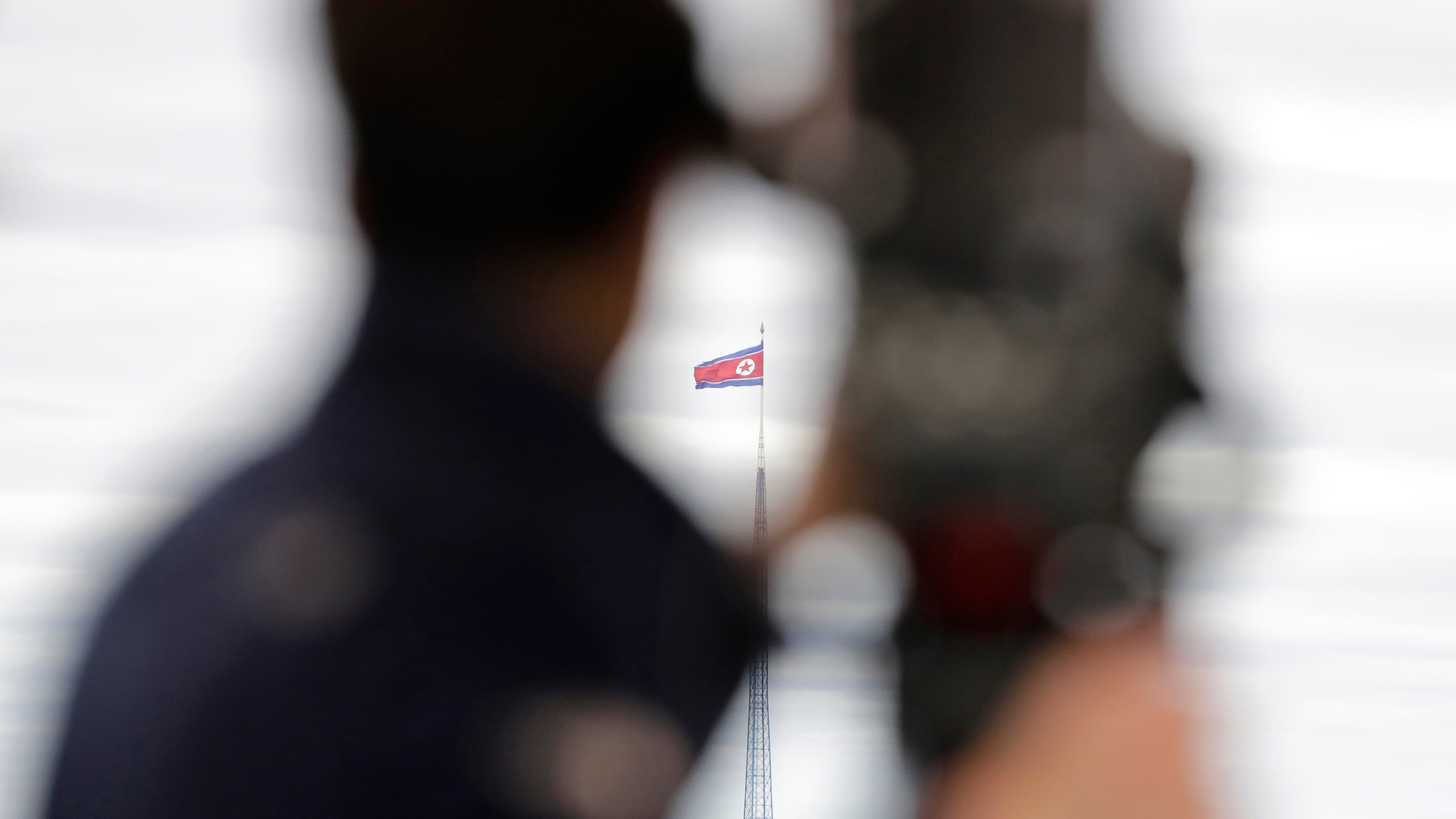 FILE - A North Korean flag flutters in the wind atop a 160-meter tower in North Korea's village Gijungdong as seen from the Taesungdong freedom village inside the demilitarized zone in Paju, South Korea on April 24, 2018. (AP Photo/Lee Jin-man, File)