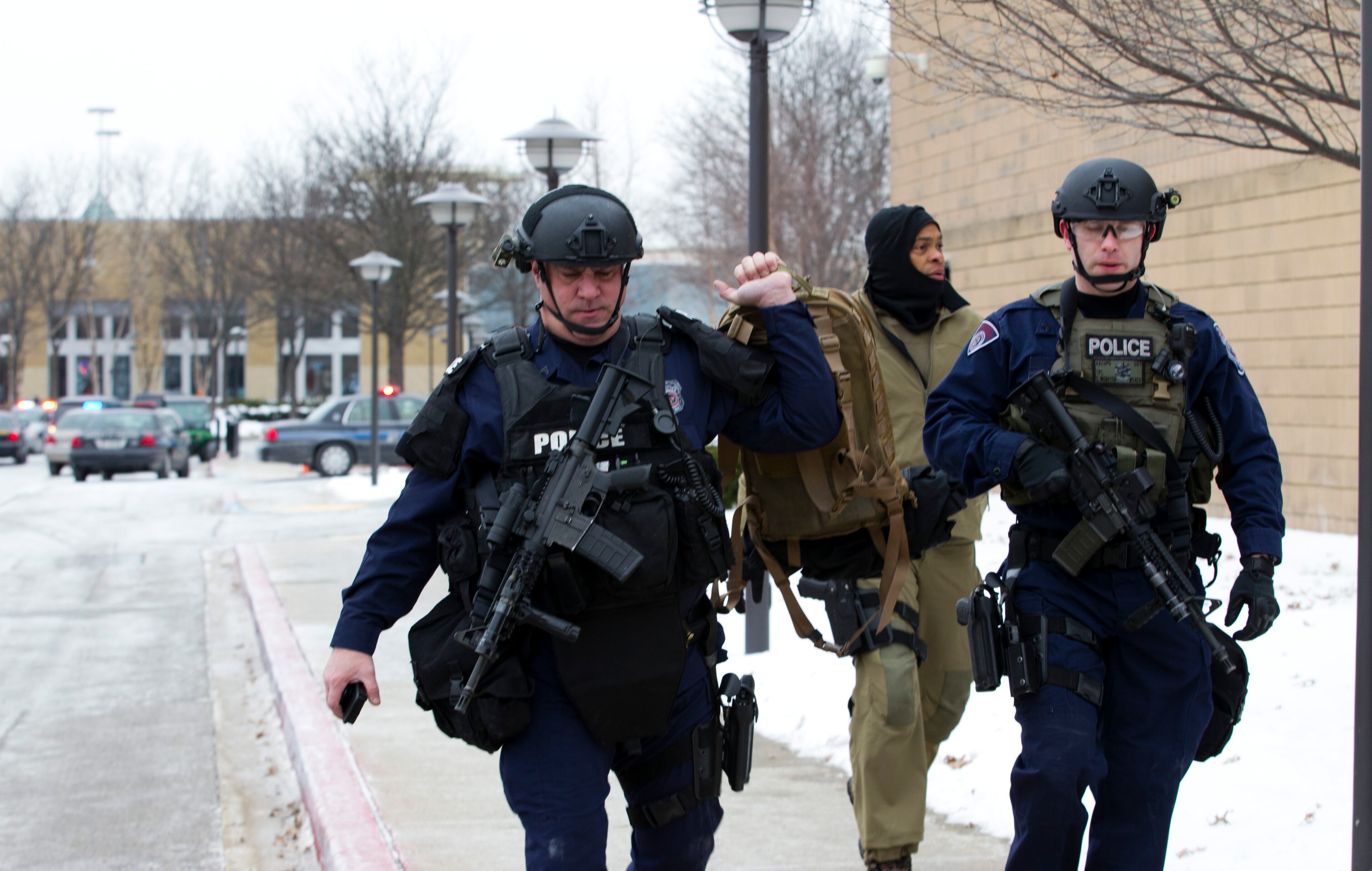 Police move in from a parking lot to the Mall in Columbia after reports of a multiple shooting.