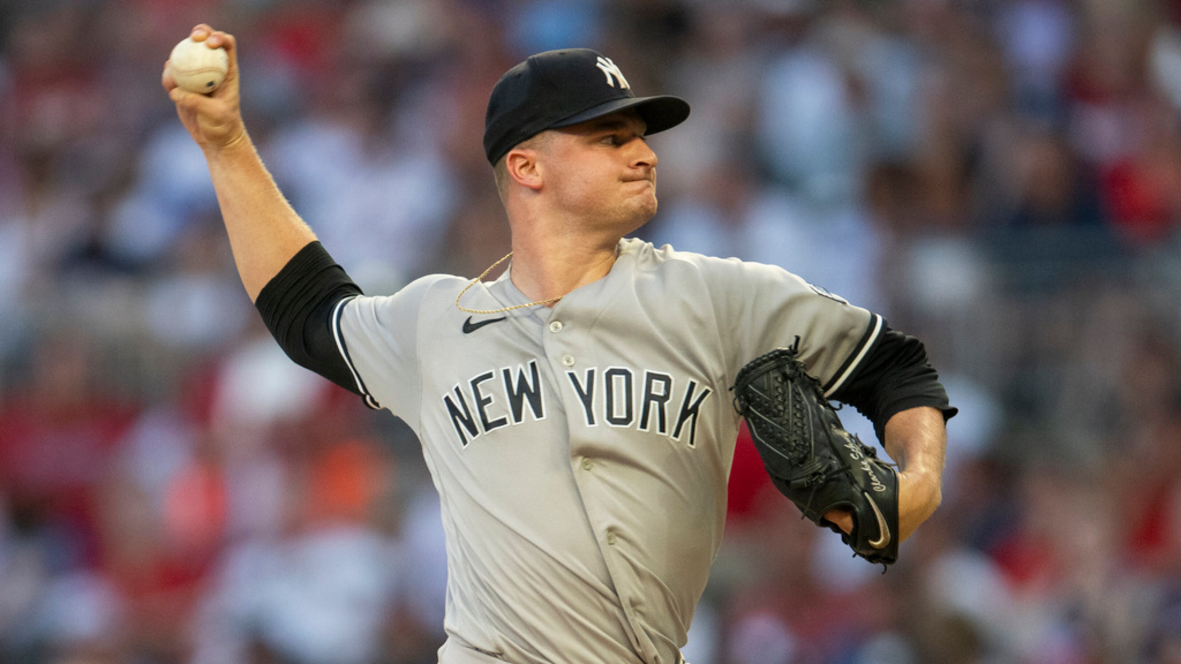 New York Yankees' starting pitcher Clarke Schmidt throws in the first inning of a baseball game against the Atlanta Braves, Monday, Aug. 14, 2023, in Atlanta. (AP Photo/Hakim Wright Sr.)
